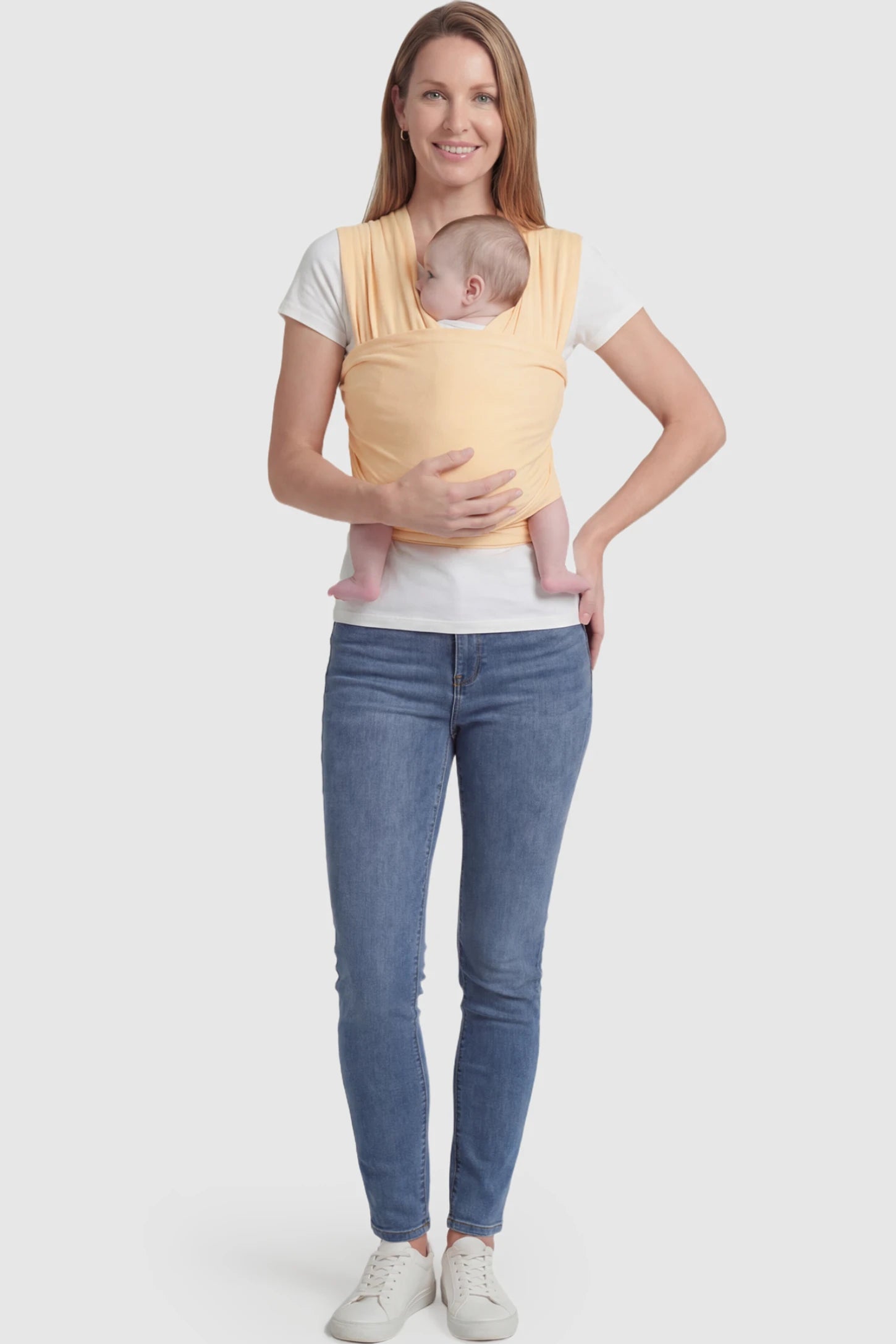Soft Stretch Adjustable Baby Wrap Carrier Soft Stretch Adjustable Baby Wrap Carrier in pale Yellow featuring a polyester blend holding a baby.