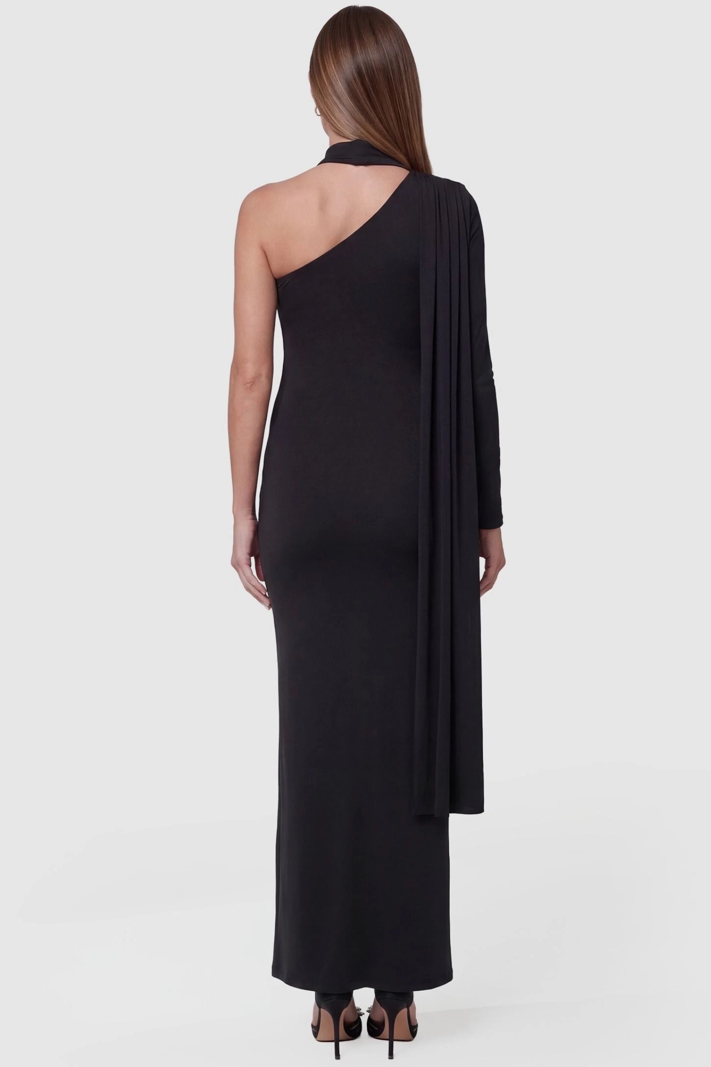 Soft Stretch One-Sleeve Halter Maternity Dress One-Sleeve Halter Maternity Dress in Black featuring a high-neck halter design on a pregnant model back view.