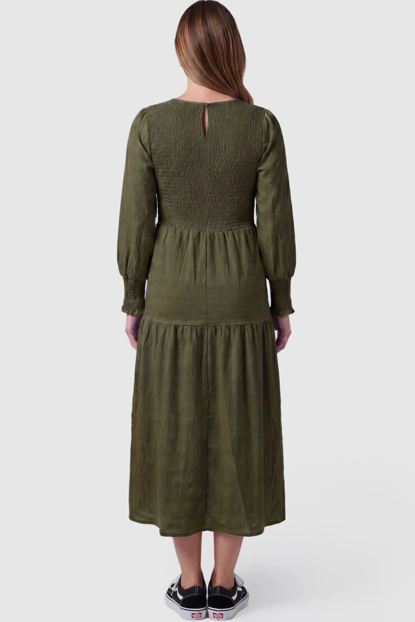 Solid Color Tiered Style Midi Maternity Dress Solid Color Tiered Style Midi Maternity Dress in green featuring a smocked bodice on a pregnant model, back view.