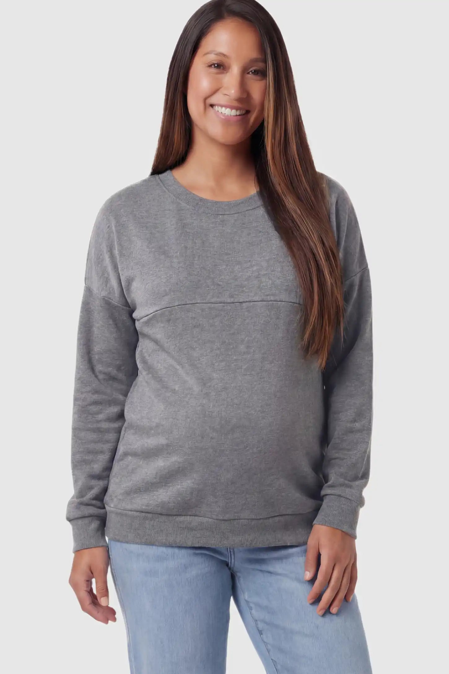 Solid Long Sleeve Maternity & Nursing Sweatshirt Solid Long Sleeve Maternity & Nursing Sweatshirt in Dark Gray featuring a hidden zip raised seam on a pregnant model posing front.