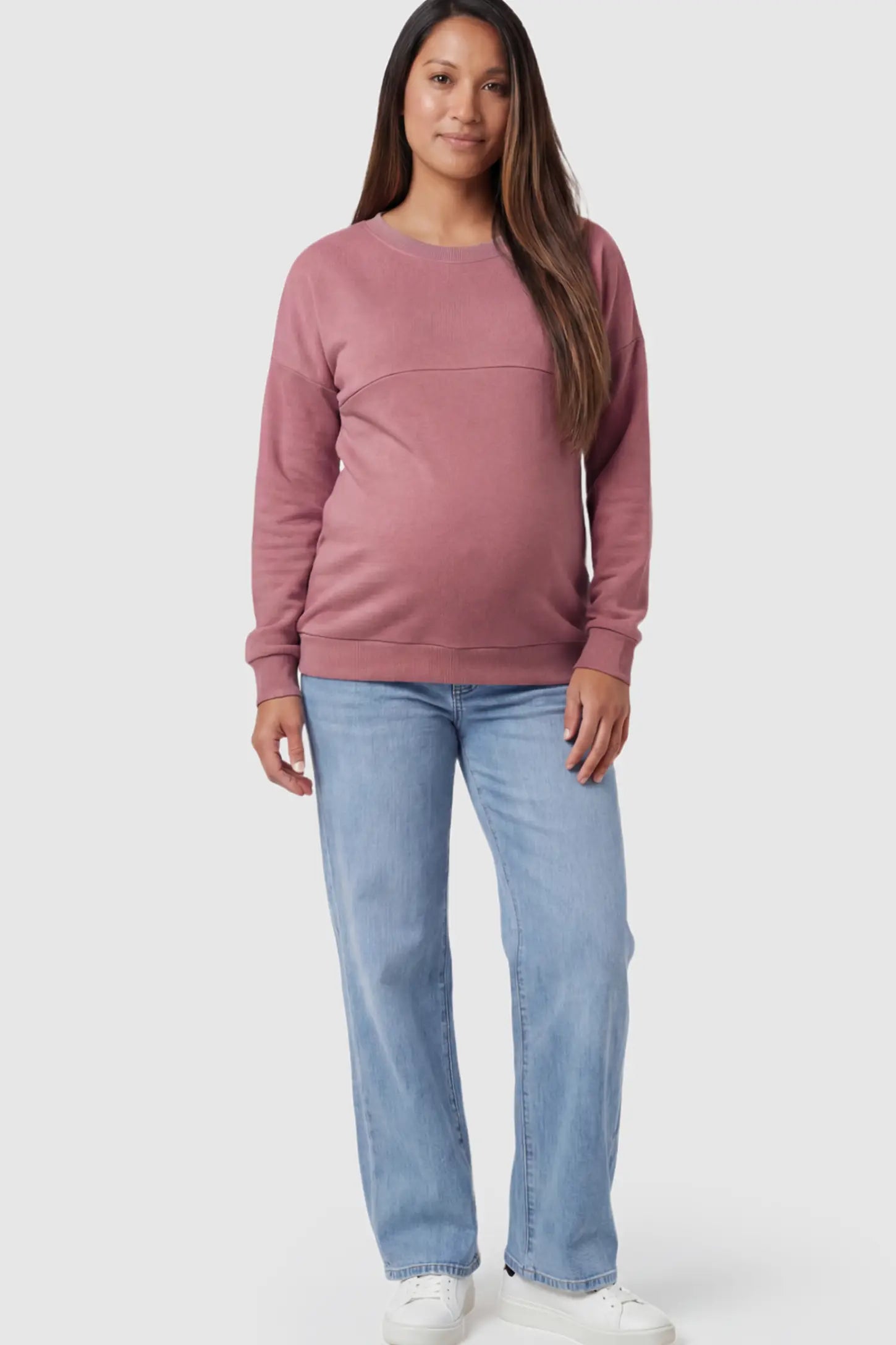 Solid Long Sleeve Maternity & Nursing Sweatshirt Solid Long Sleeve Maternity & Nursing Sweatshirt in Pink featuring a hidden zip raised seam on a pregnant model.