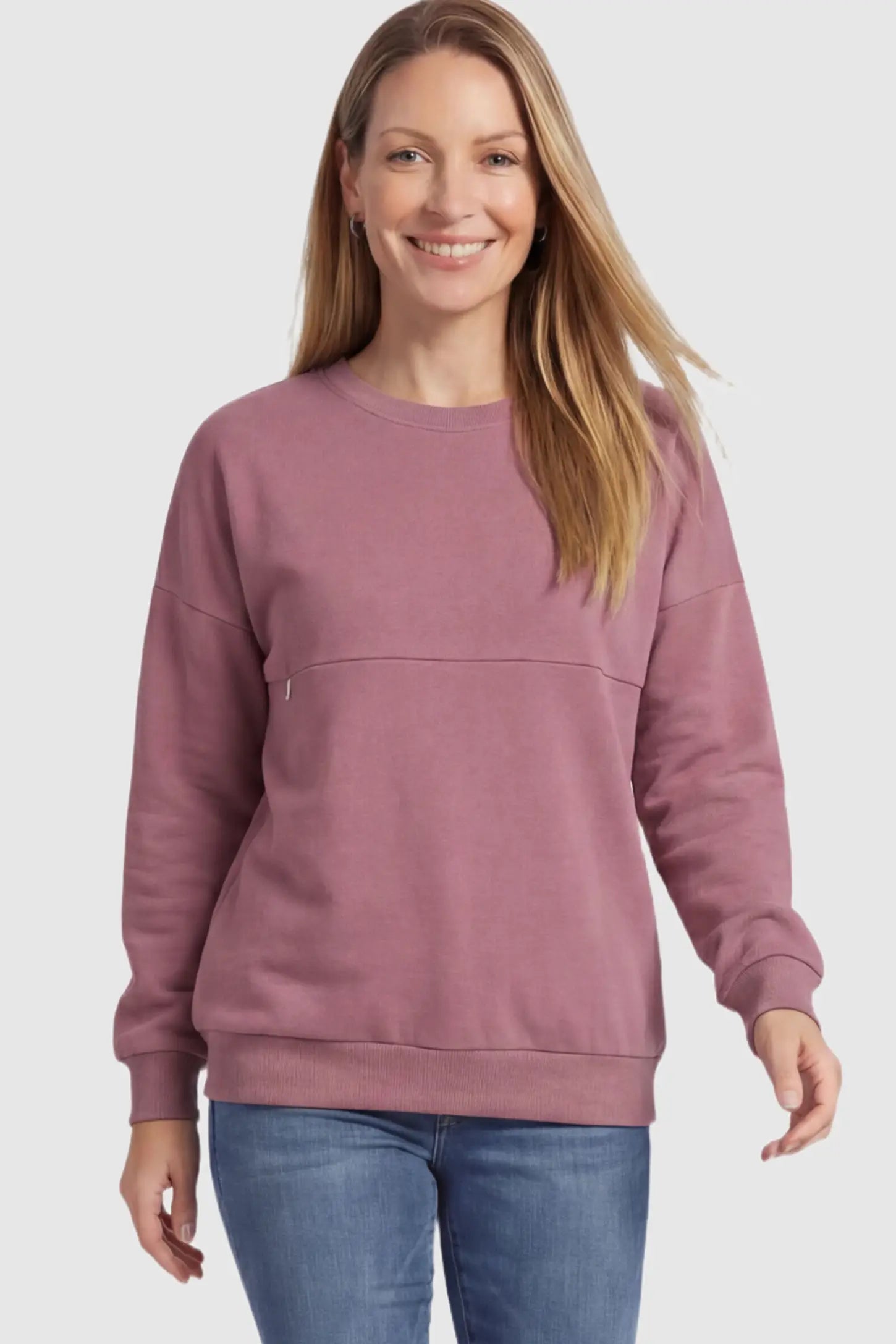 Solid Long Sleeve Maternity & Nursing Sweatshirt Solid Long Sleeve Maternity & Nursing Sweatshirt in Pink featuring a hidden zip raised seam on a postpartum model.