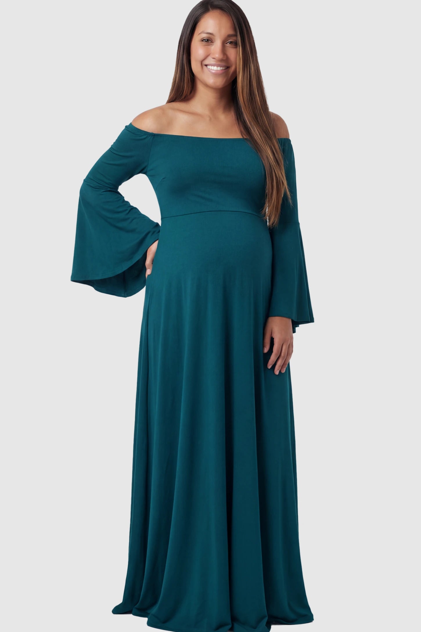 Solid Off Shoulder Bell Sleeve Maternity Maxi Dress Solid Off Shoulder Bell Sleeve Maternity Maxi Dress in Navy Blue featuring Bell sleeves on a pregnant model showing front.