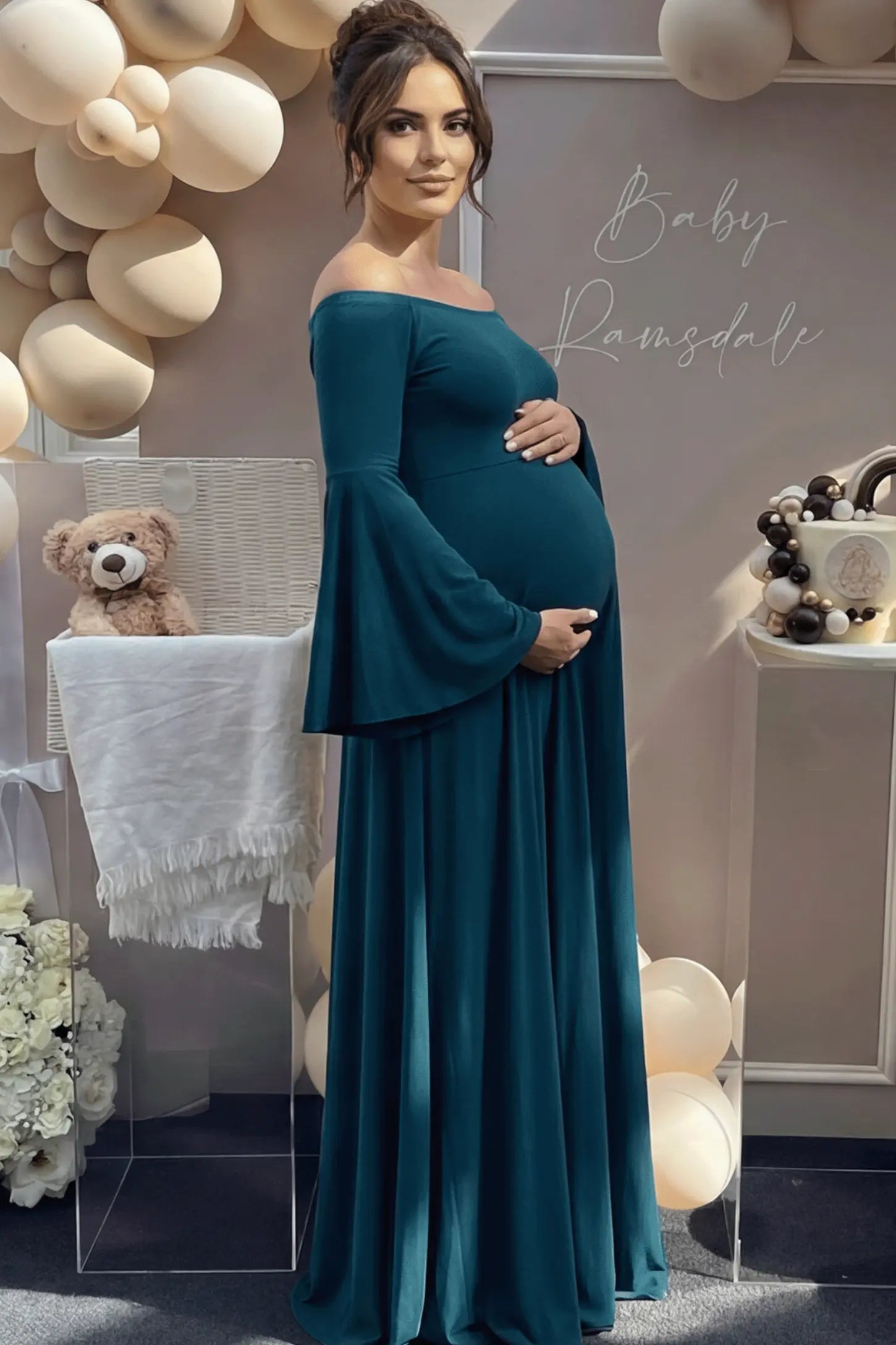 Solid Off Shoulder Bell Sleeve Maternity Maxi Dress Solid Off Shoulder Bell Sleeve Maternity Maxi Dress in Navy Blue featuring Bell sleeves on a pregnant model showing side.