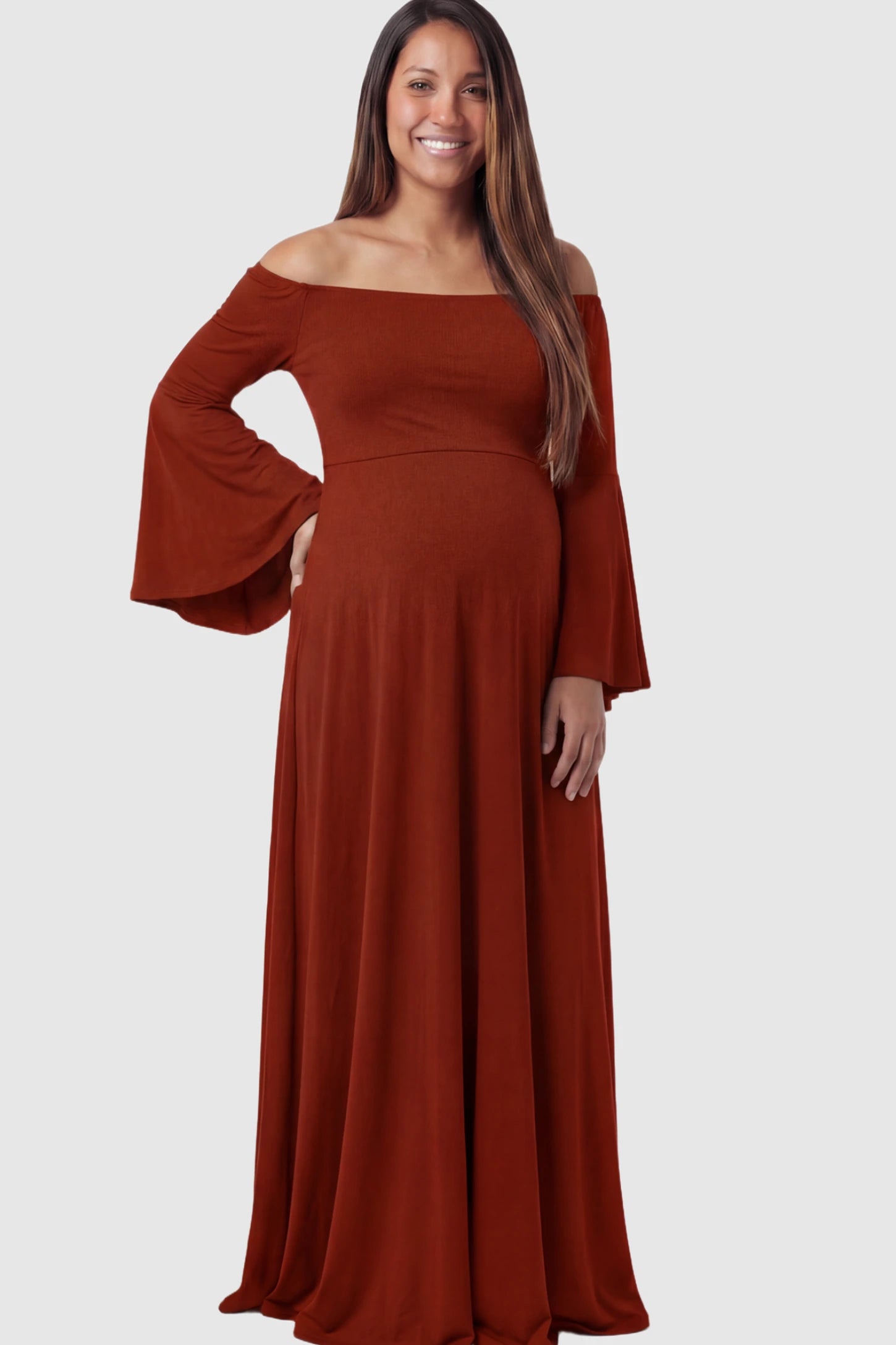 Solid Off Shoulder Bell Sleeve Maternity Maxi Dress Solid Off Shoulder Bell Sleeve Maternity Maxi Dress in Red featuring Bell sleeves on a pregnant model showing front.