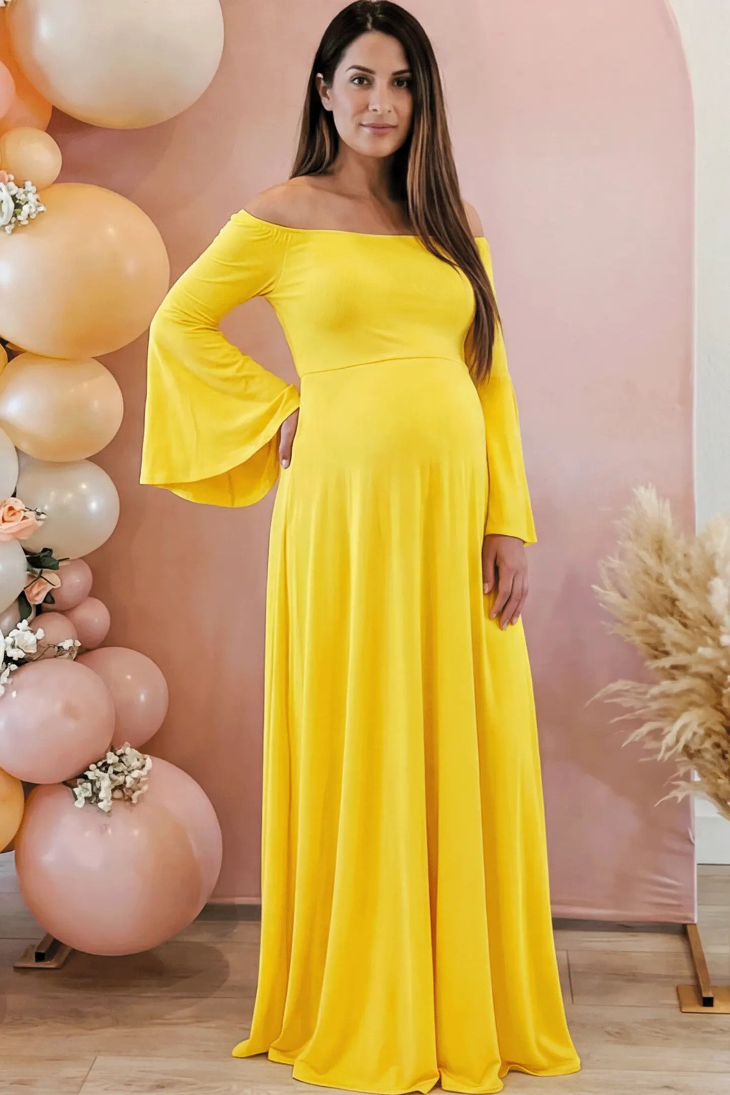 Solid Off Shoulder Bell Sleeve Maternity Maxi Dress Solid Off Shoulder Bell Sleeve Maternity Maxi Dress in Yellow featuring Bell sleeves on a pregnant model showing front.