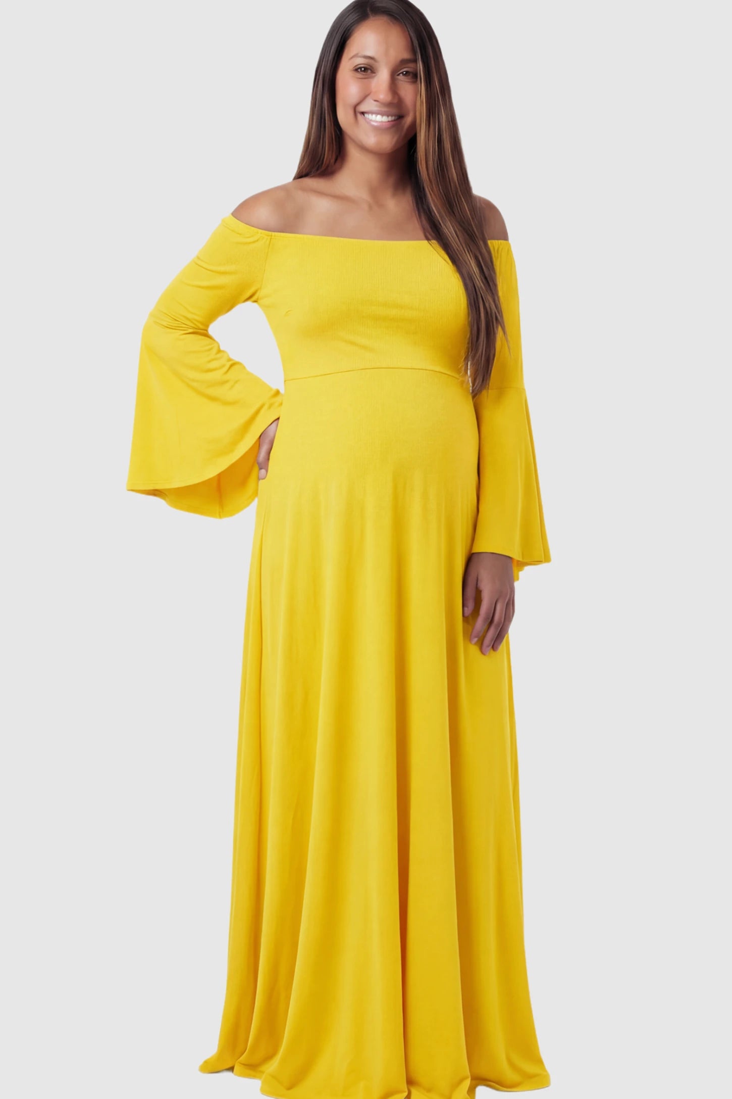 Solid Off Shoulder Bell Sleeve Maternity Maxi Dress Solid Off Shoulder Bell Sleeve Maternity Maxi Dress in Yellow featuring Bell sleeves on a pregnant model showing front.