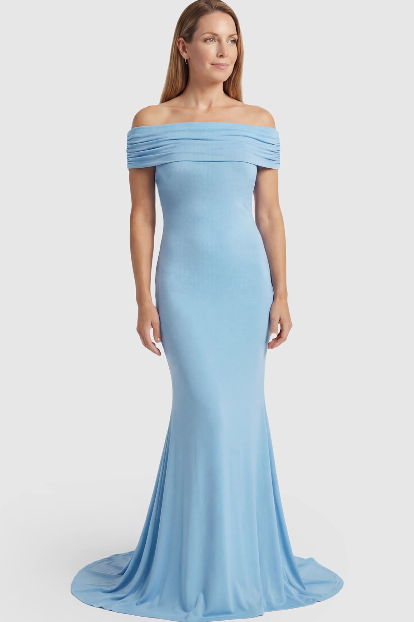 Solid Off Shoulder Maternity Photoshoot Gown Solid Off-Shoulder Maternity Photoshoot Gown in light blue featuring subtle train on a postpartum model showing front.