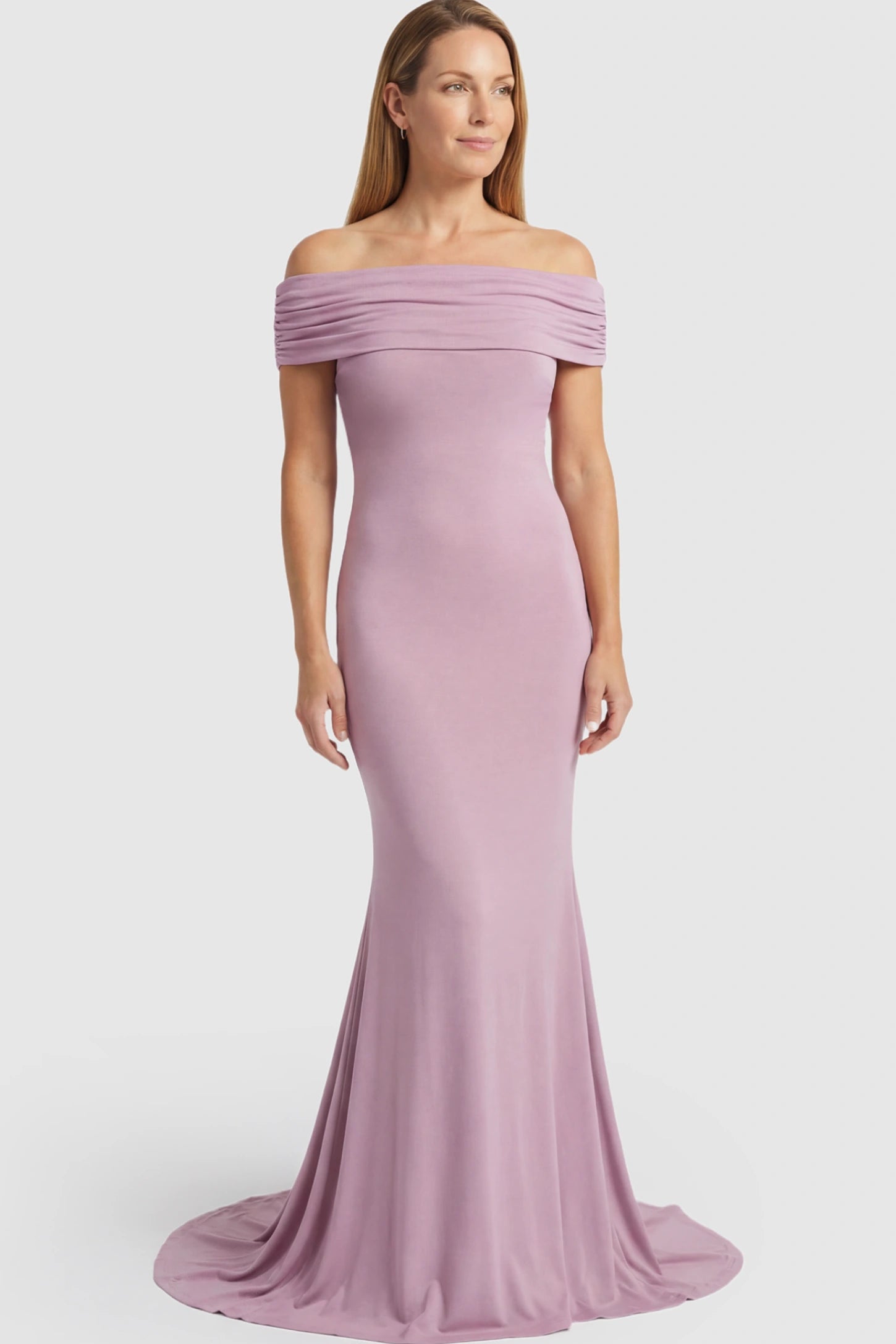 Solid Off Shoulder Maternity Photoshoot Gown Solid Off-Shoulder Maternity Photoshoot Gown in Pink featuring subtle train on a postpartum model showing front.