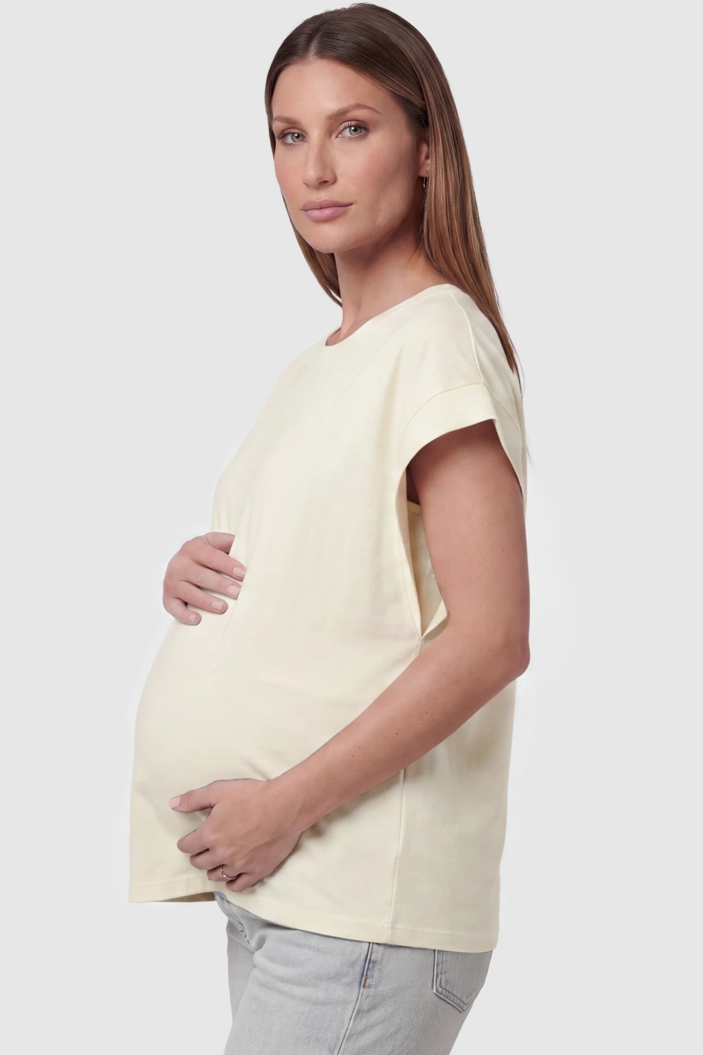 Solid Round Neck Cap Sleeve Maternity Top Solid Round Neck Cap Sleeve Maternity Top in Beige featuring breathable fabric on a pregnant model, side view.