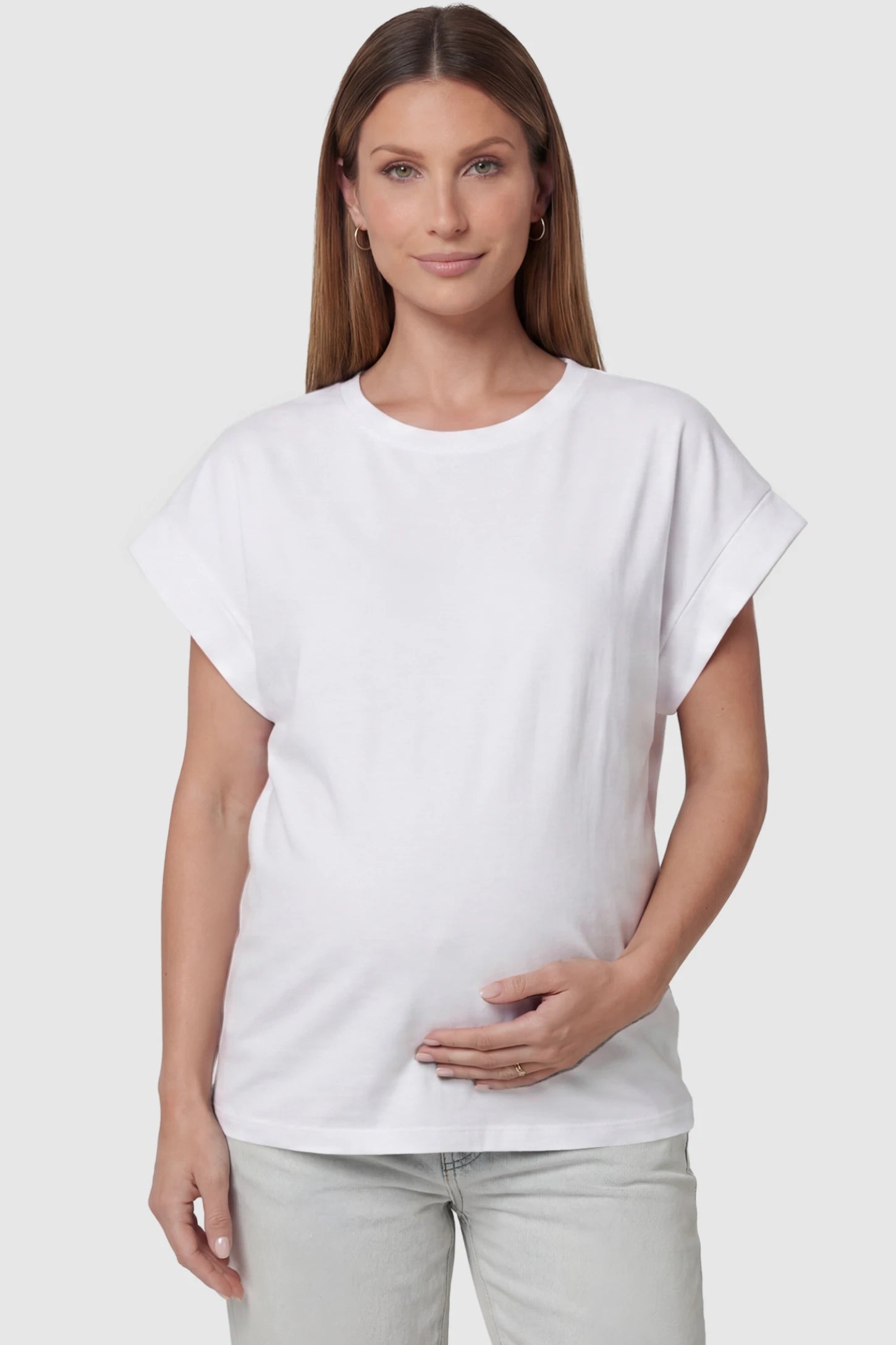 Solid Round Neck Cap Sleeve Maternity Top Solid Round Neck Cap Sleeve Maternity Top in White featuring breathable fabric on a pregnant model, front view.