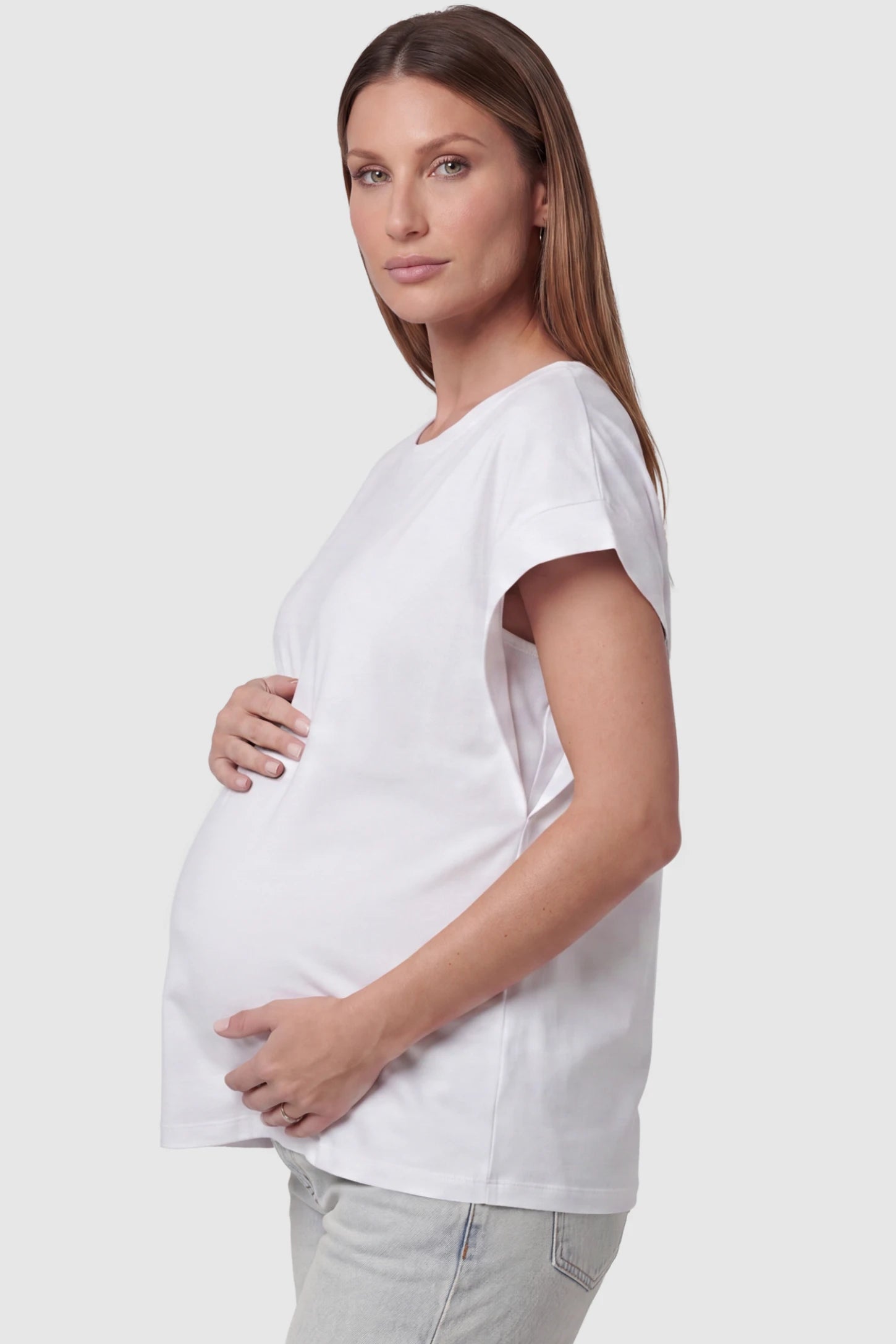 Solid Round Neck Cap Sleeve Maternity Top Solid Round Neck Cap Sleeve Maternity Top in White featuring breathable fabric on a pregnant model, side view.