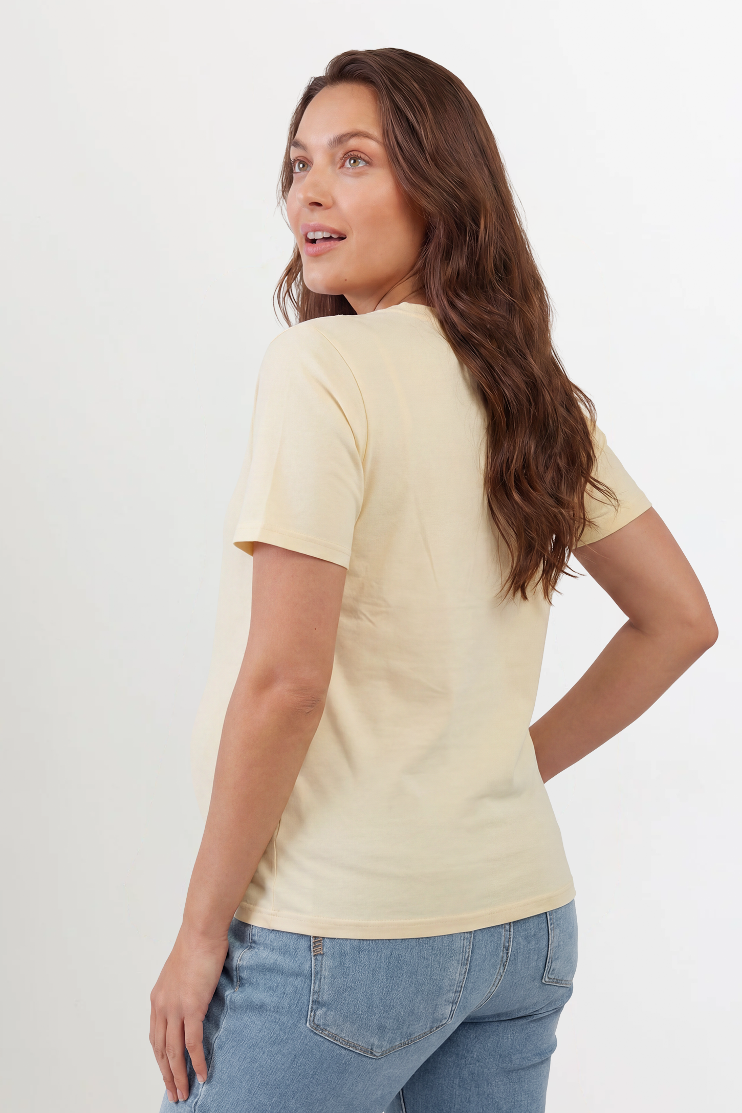 Solid Round Neck Short Sleeve Maternity Top Solid Round Neck Short Sleeve Maternity Top in Beige featuring a soft-touch finish and relaxed fit on a pregnant model, back view.