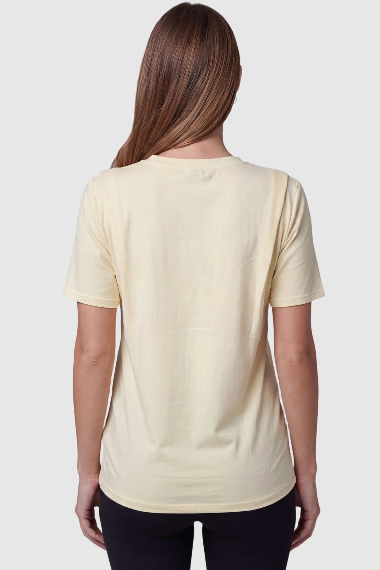 Solid Round Neck Short Sleeve Maternity Top Solid Round Neck Short Sleeve Maternity Top in Beige featuring a soft-touch finish and relaxed fit on a pregnant model, back view.