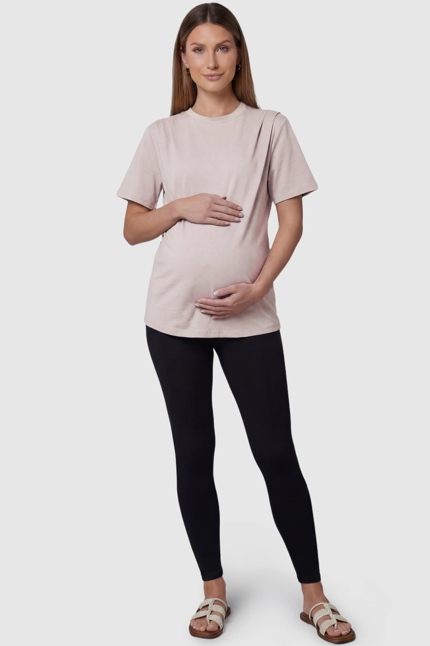 Solid Round Neck Short Sleeve Maternity Top Solid Round Neck Short Sleeve Maternity Top in Brown featuring a soft-touch finish and relaxed fit on a pregnant model, full body view.