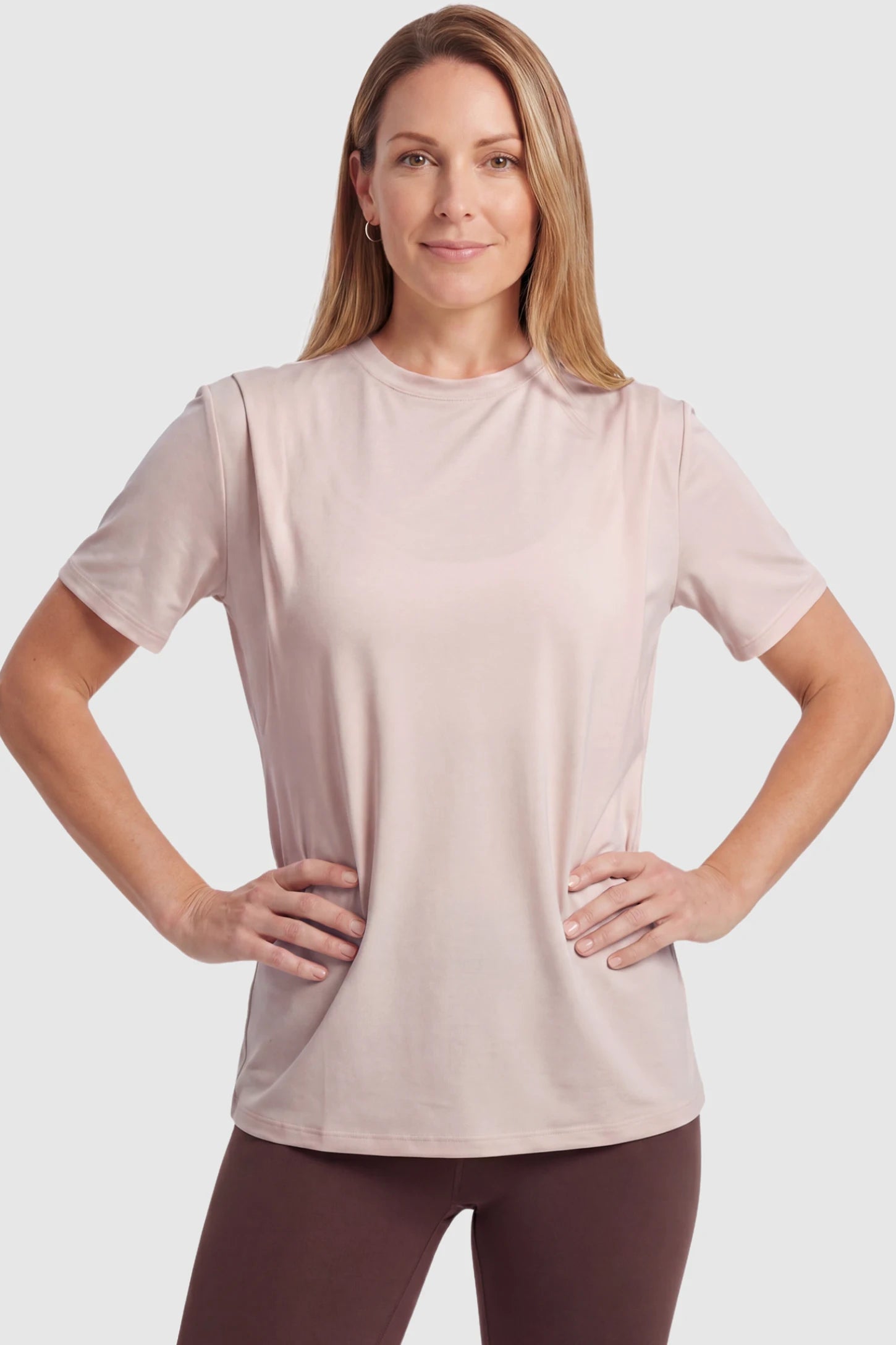 Solid Round Neck Short Sleeve Maternity Top Solid Round Neck Short Sleeve Maternity Top in Brown featuring a soft-touch finish and relaxed fit on a postpartum model, front view.