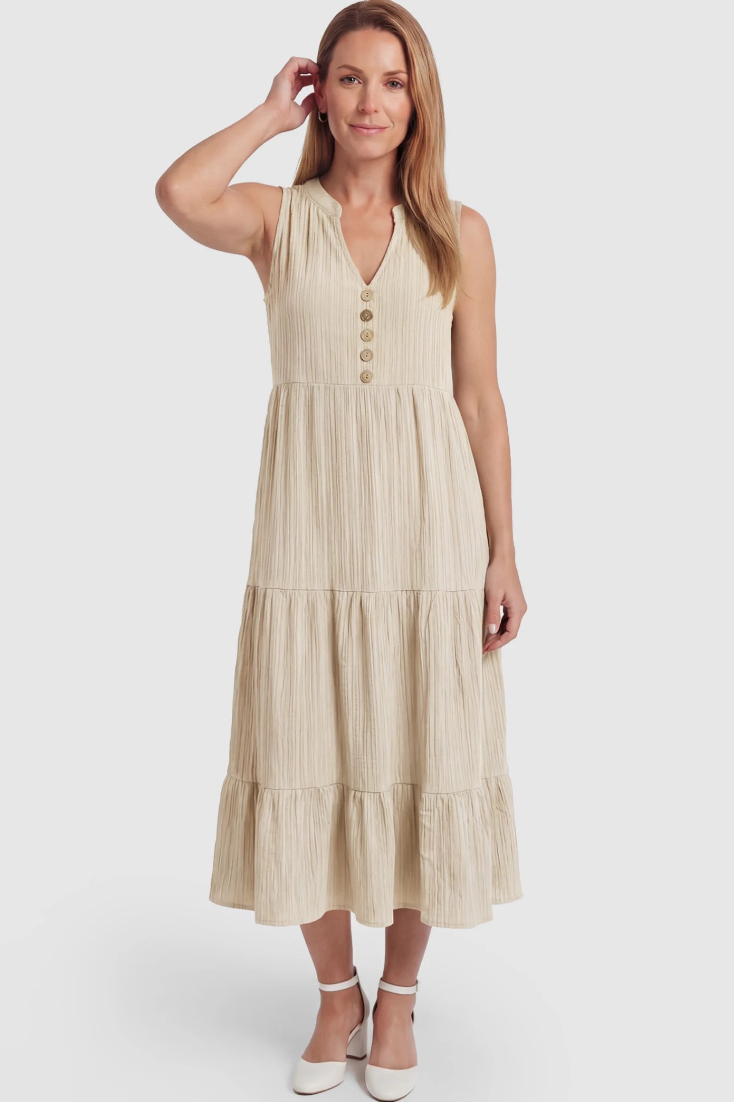 Solid Textured V-Neck Tiered Maternity Midi Dress Solid Textured V-Neck Tiered Maternity Midi Dress in Apricot featuring a high-waisted A-line silhouette on a postpartum model.