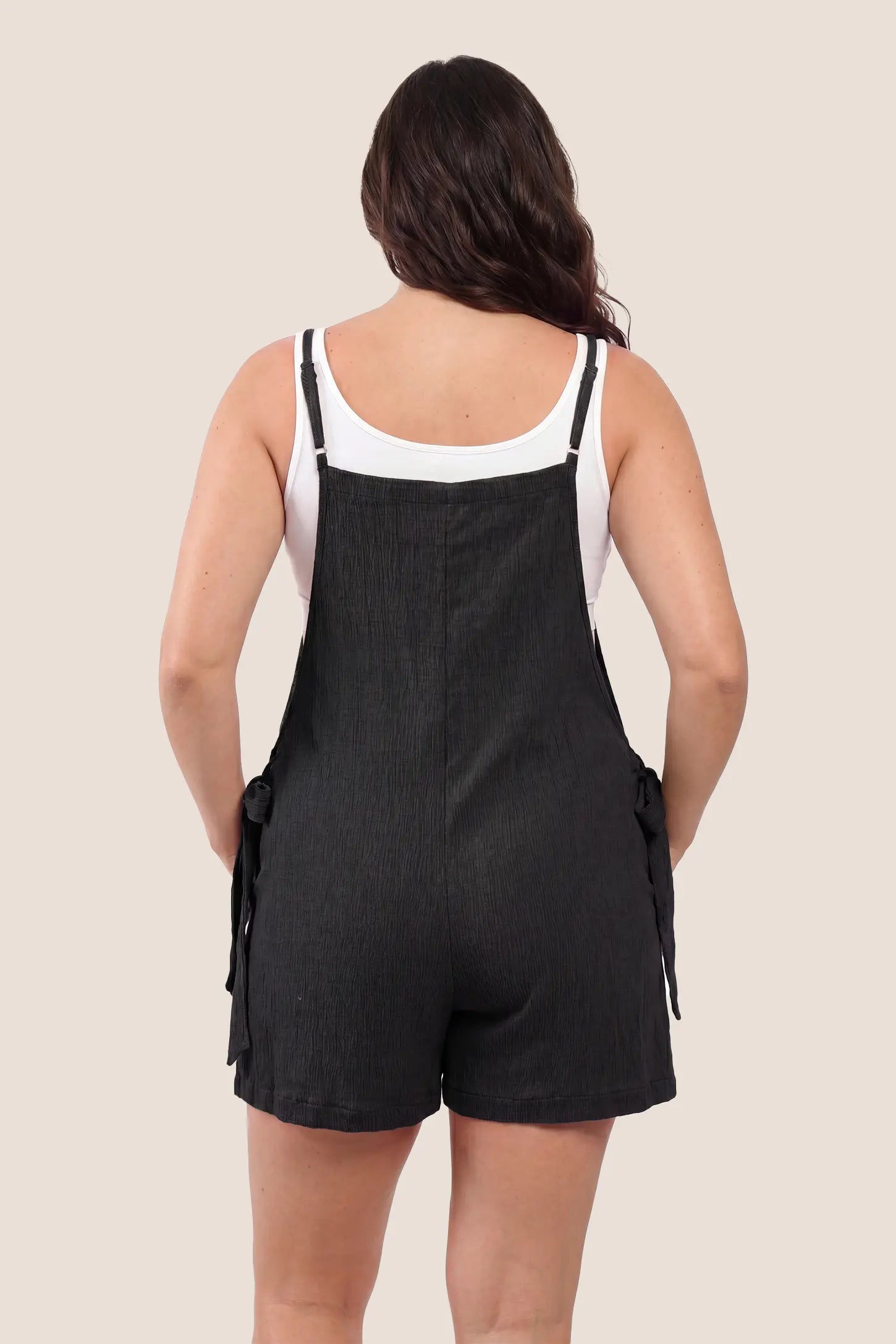 Spaghetti Strap Tie-Side Maternity Romper Back view of the black Spaghetti Strap Tie-Side Maternity Romper with adjustable shoulder straps and an easy silhouette.