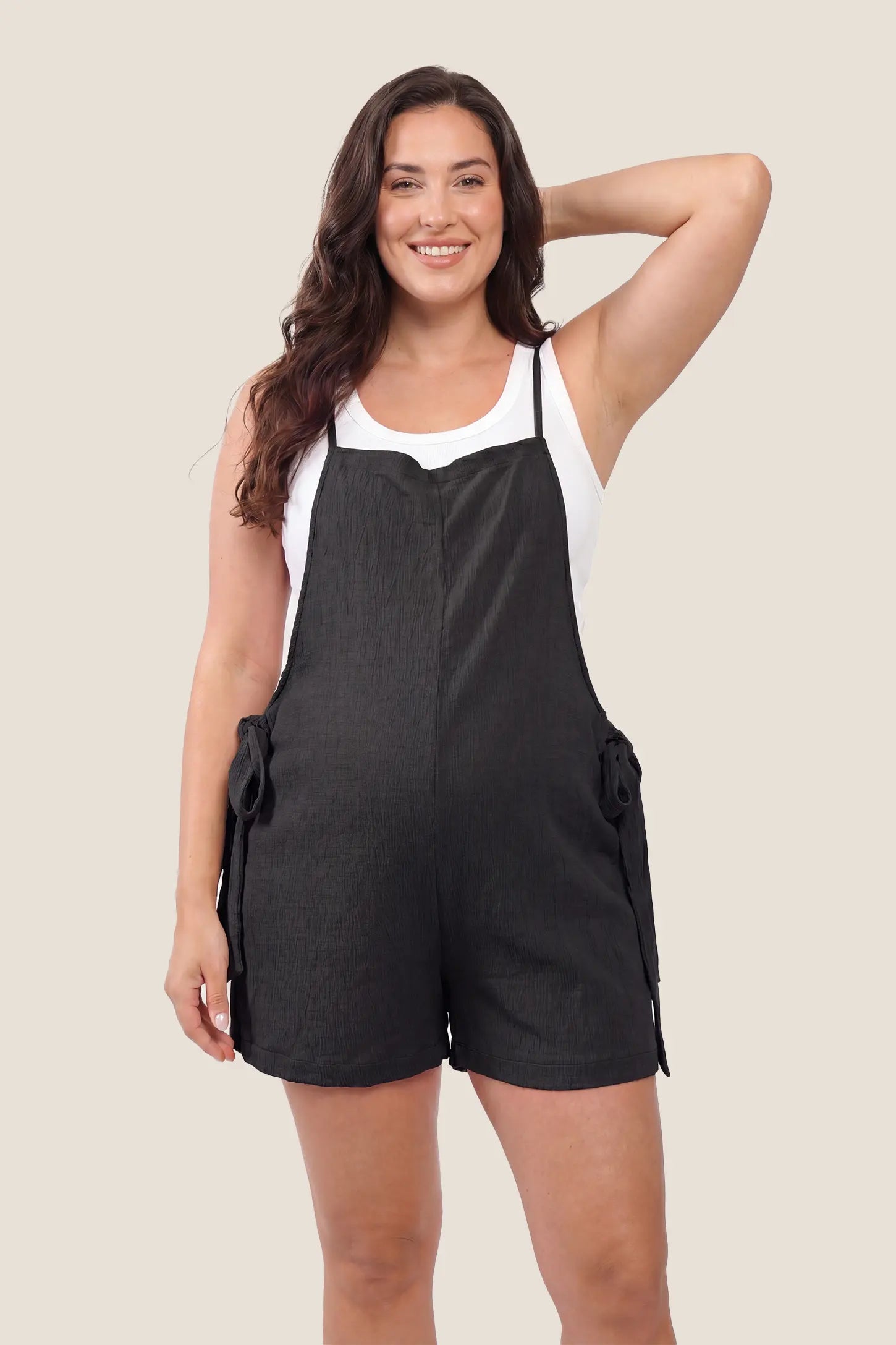 Spaghetti Strap Tie-Side Maternity Romper Front view of the black Spaghetti Strap Tie-Side Maternity Romper with a relaxed fit for comfortable maternity wear.