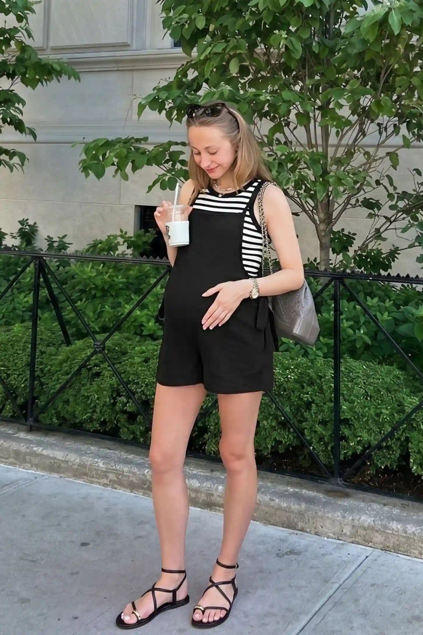 Spaghetti Strap Tie-Side Maternity Romper Spaghetti Strap Tie-Side Maternity Romper in Black featuring a square neckline on a front-facing pregnant model.