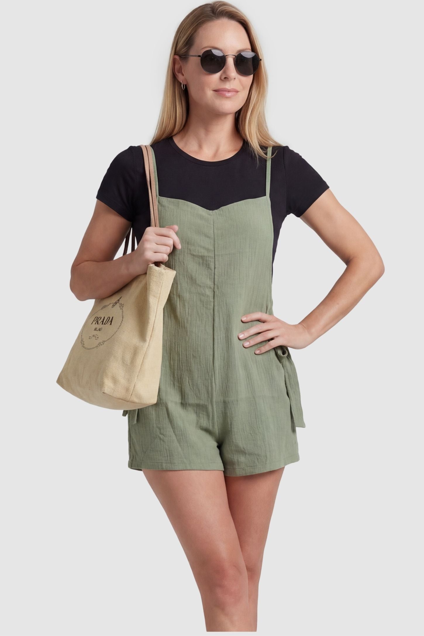 Spaghetti Strap Tie-Side Maternity Romper ostpartum model in Green Spaghetti Strap Tie-Side Maternity Romper showcasing the flexible, non-restrictive waist for easy movement.