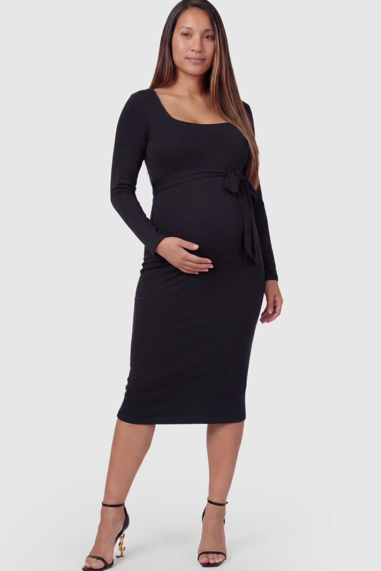 Square Neck Side-Tie Maternity Midi Dress in Black featuring a long-sleeve bodycon fit on a pregnant model posing front.