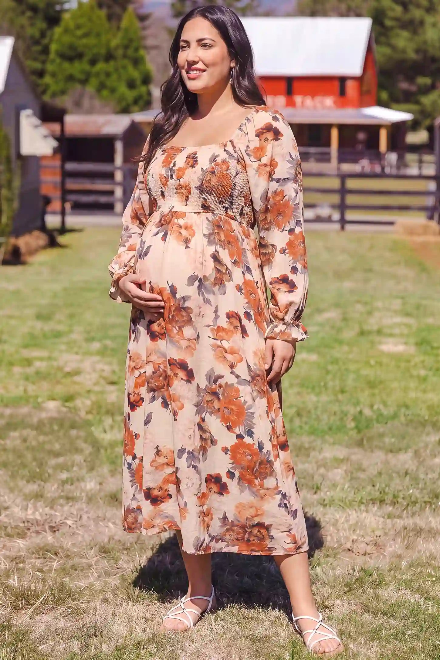 Square Neck Smocked Floral Maternity Midi Dress Square Neck Smocked Floral Maternity Midi Dress in Rust Floral featuring a flattering A-line fit, lifestyle view on a plus-size model.