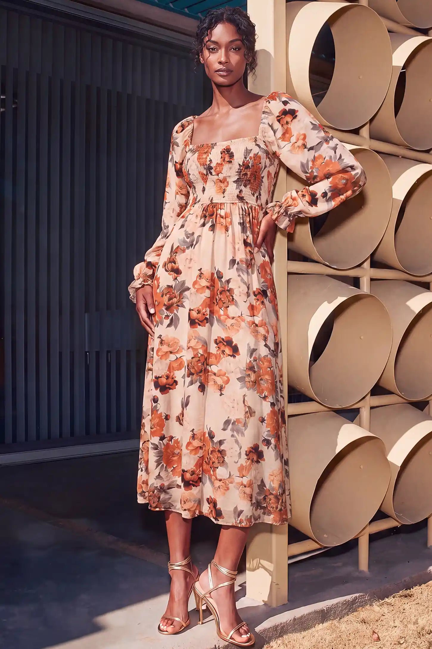 Square Neck Smocked Floral Maternity Midi Dress Square Neck Smocked Floral Maternity Midi Dress in Rust Floral showcasing versatile postpartum style with stretchy smocked bodice, lifestyle view on a non pregnant model.