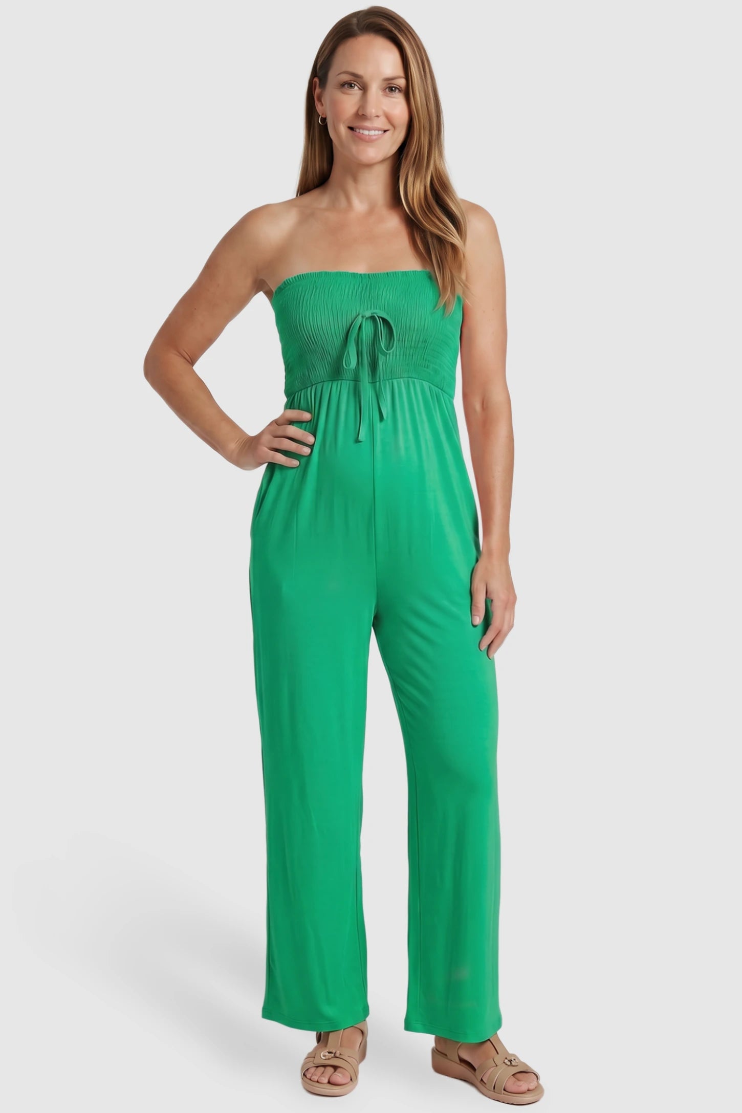 Strapless Smocked Bust Wide Leg Maternity Jumpsuit Strapless Smocked Bust Wide Leg Maternity Jumpsuit in Green featuring a relaxed leg design on a postpartum model, front view.