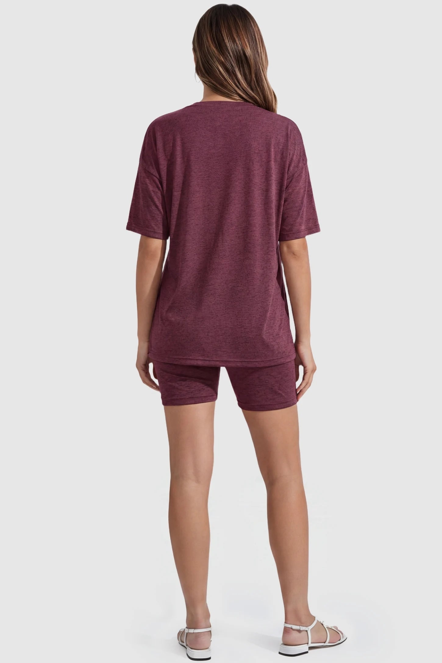 Stretch Oversized Tee & Biker Short Maternity Lounge Set Stretch Oversized Tee & Biker Short Maternity Lounge Set in burgundy featuring an oversized tee with drop shoulders on a pregnant model, back view.