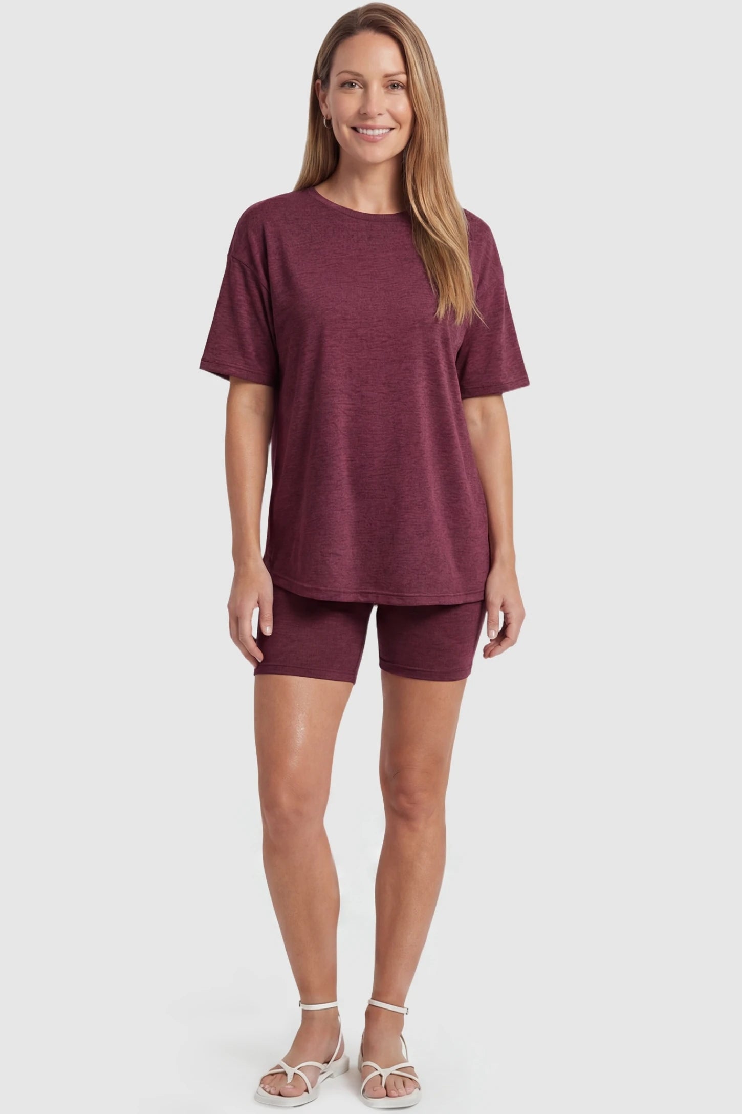 Stretch Oversized Tee & Biker Short Maternity Lounge Set Stretch Oversized Tee & Biker Short Maternity Lounge Set in burgundy featuring flexible biker shorts on a non-pregnant model, postpartum view.
