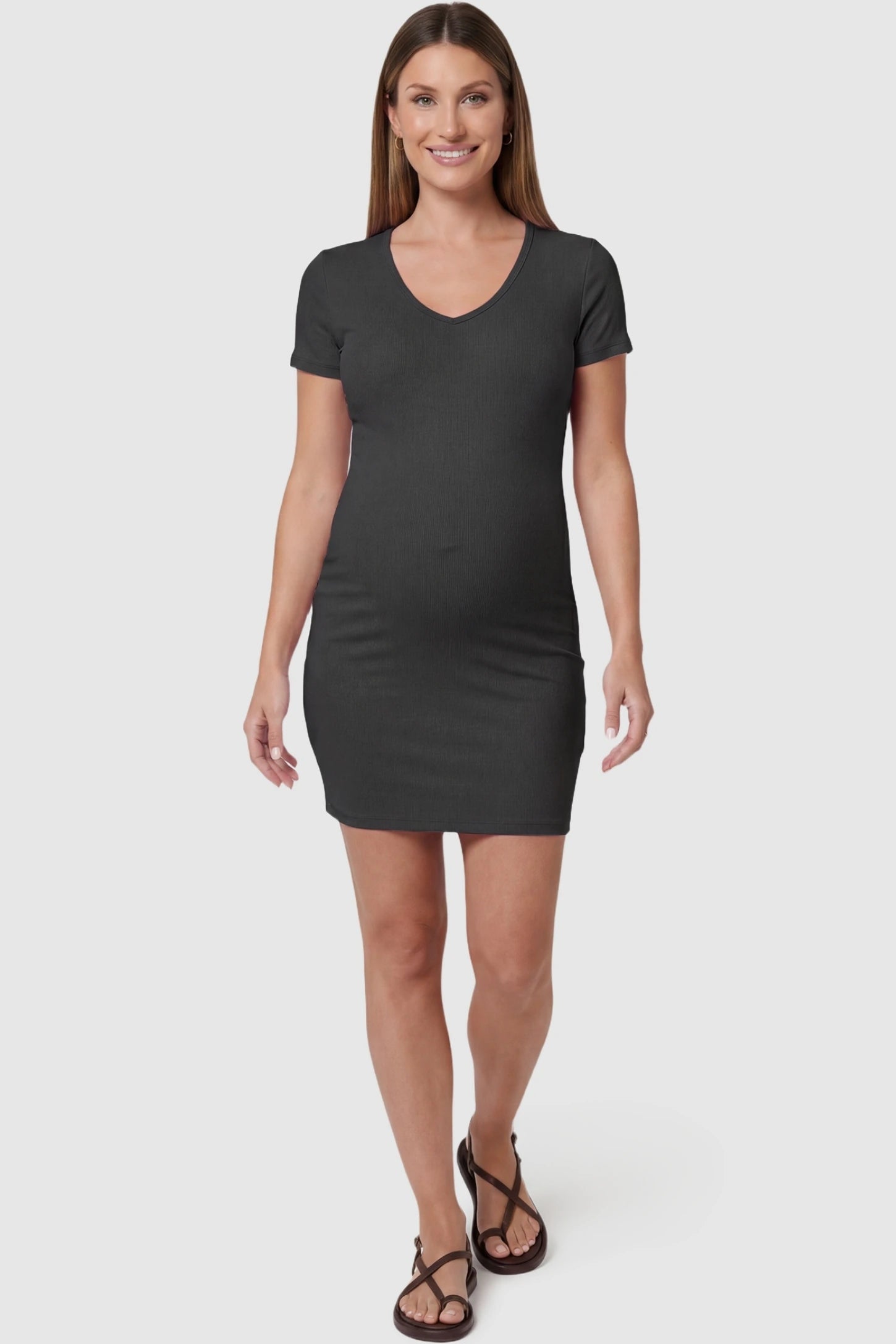 Stretchy Ribbed Short Sleeve Maternity Bodycon Dress Front (Pregnant): Stretchy Ribbed Short Sleeve Maternity Bodycon Dress in Dark Grey featuring a form-fitting ribbed fabric on a pregnant model, front view.