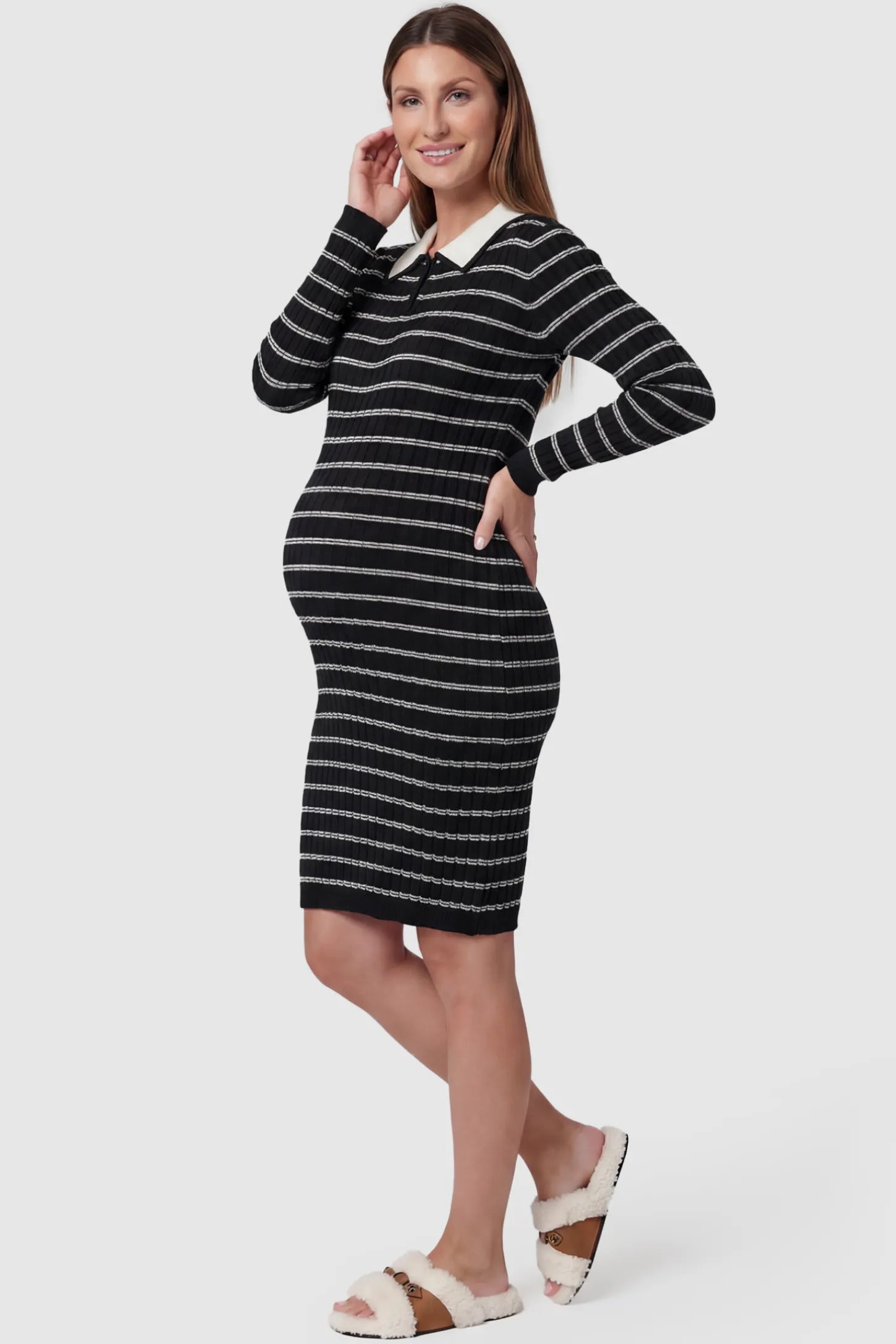 Striped Knit Collared Maternity Midi Dress Rib-Knit Straight-Tube Maternity Midi in Black Stripes featuring a contrast polo collar on a pregnant model, side view.