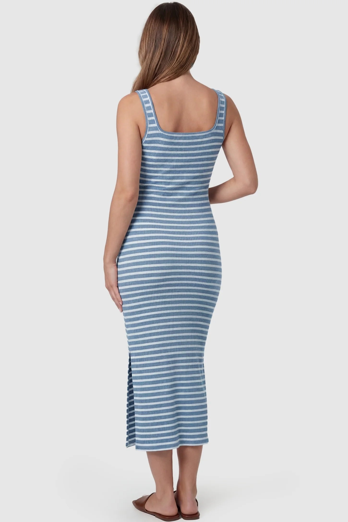 Striped Ribbed Sleeveless Maternity Midi Dress Striped Ribbed Sleeveless Maternity Midi Dress in Blue featuring a high-stretch ribbed texture on a pregnant model, back view.