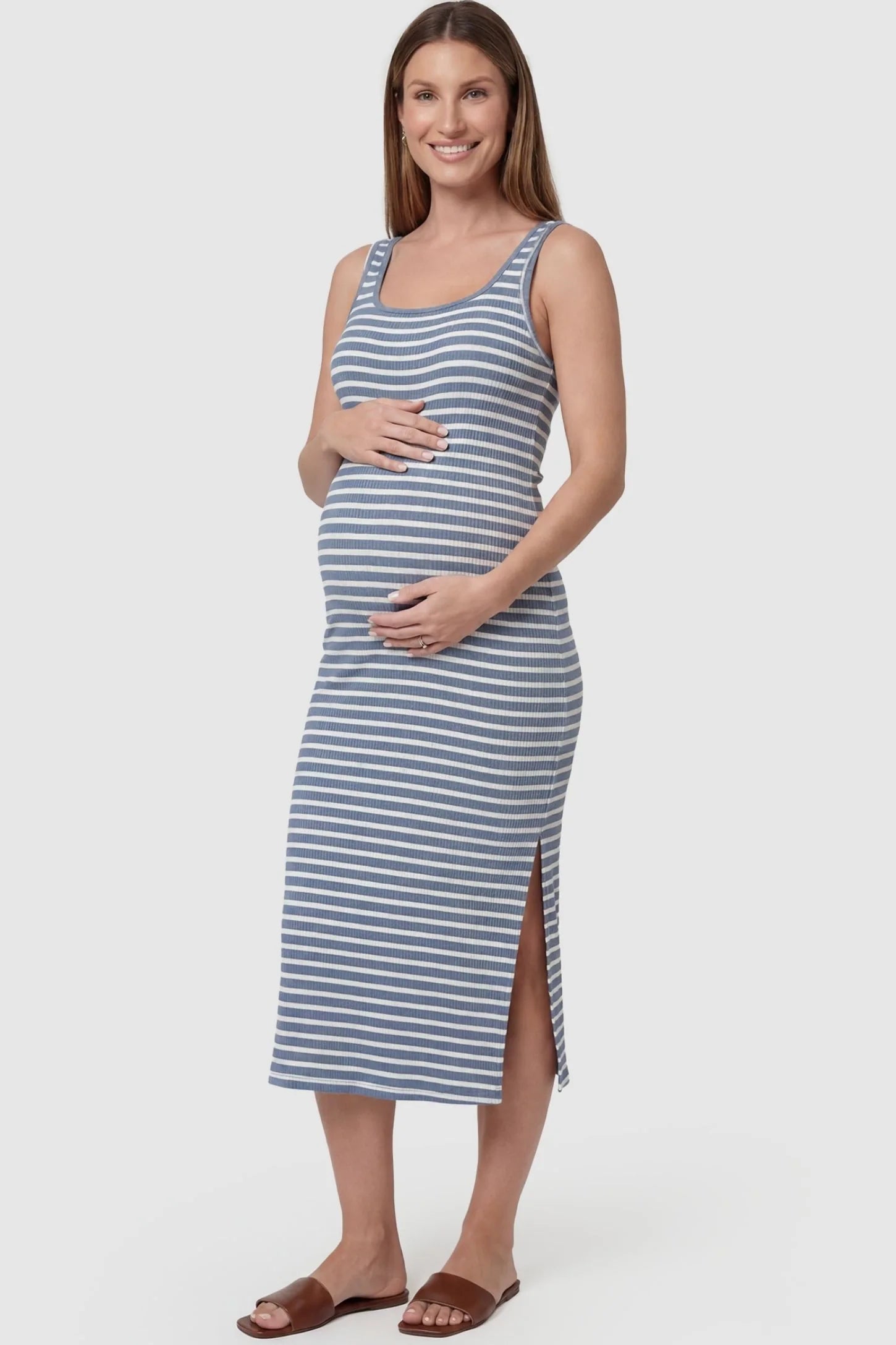 Striped Ribbed Sleeveless Maternity Midi Dress in Blue featuring a bold horizontal stripe pattern on a pregnant model, front view.