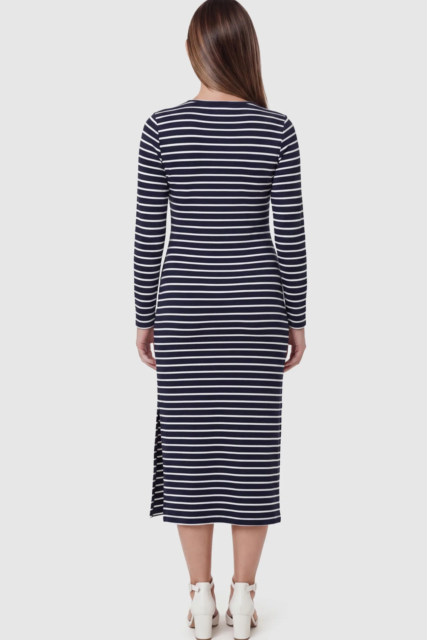 Striped Side Slit Long Sleeve Bodycon Maternity Midi Dress Striped side slit long sleeve bodycon maternity midi dress in black and white featuring a flattering fit on a pregnant model showing back.