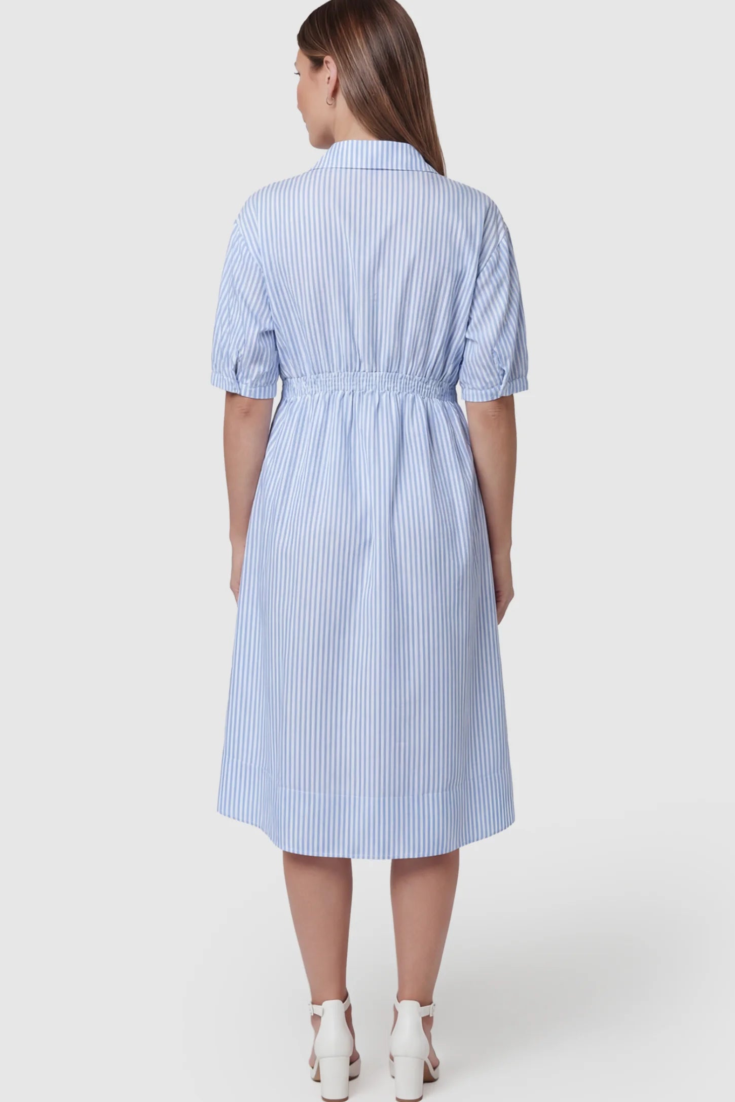 Striped Smocked Waist Button Down Maternity Shirt Dress Striped Smocked-Waist Button-Down Maternity Shirt Dress in light blue and white stripes featuring  short sleeves on a pregnant model showing back.
