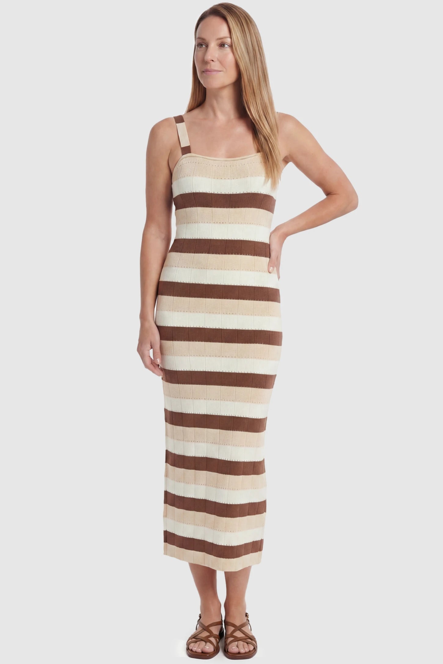 Striped Square Neck Sleeveless Maternity Midi Dress Striped Square Neck Sleeveless Maternity Midi Dress in Brown featuring adjustable slider straps and soft knit stretch on a postpartum model, front view.