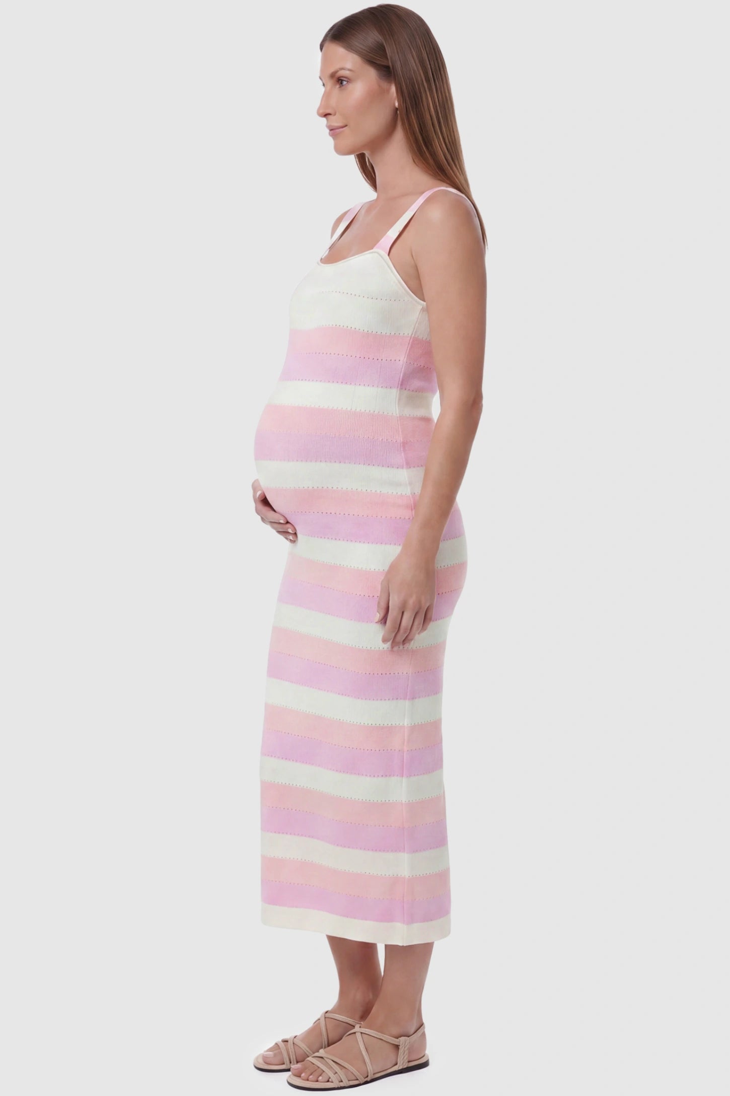Striped Square Neck Sleeveless Maternity Midi Dress Striped Square Neck Sleeveless Maternity Midi Dress in Pink featuring adjustable slider straps and soft knit stretch on a pregnant model, side view.