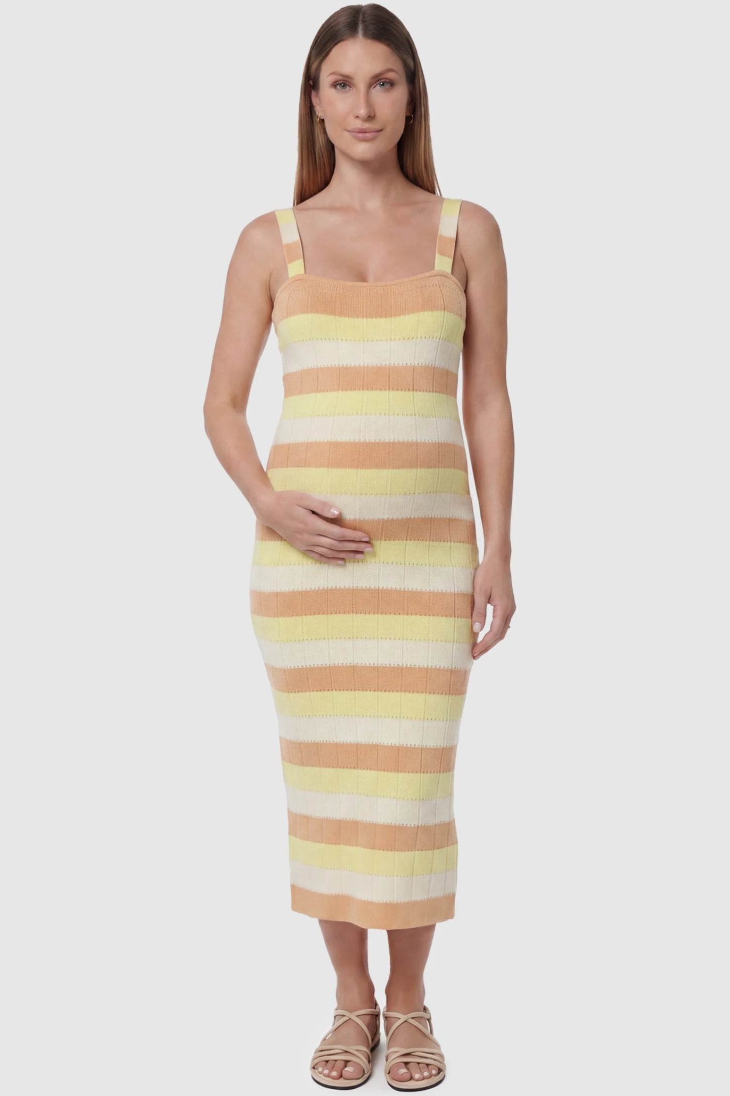 Striped Square Neck Sleeveless Maternity Midi Dress Striped Square Neck Sleeveless Maternity Midi Dress in Yellow featuring adjustable slider straps and soft knit stretch on a pregnant model, front view.