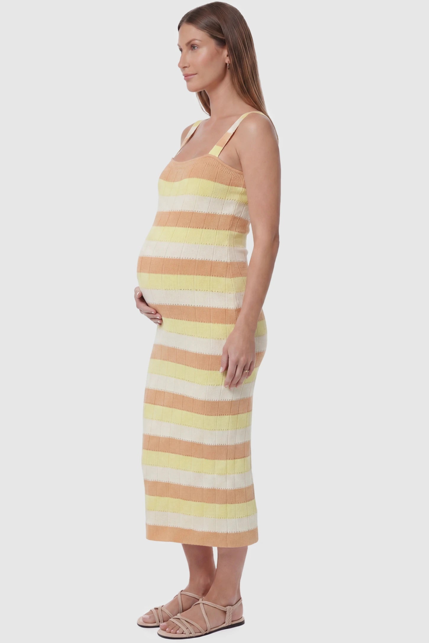 Striped Square Neck Sleeveless Maternity Midi Dress Striped Square Neck Sleeveless Maternity Midi Dress in Yellow featuring adjustable slider straps and soft knit stretch on a pregnant model, side view.