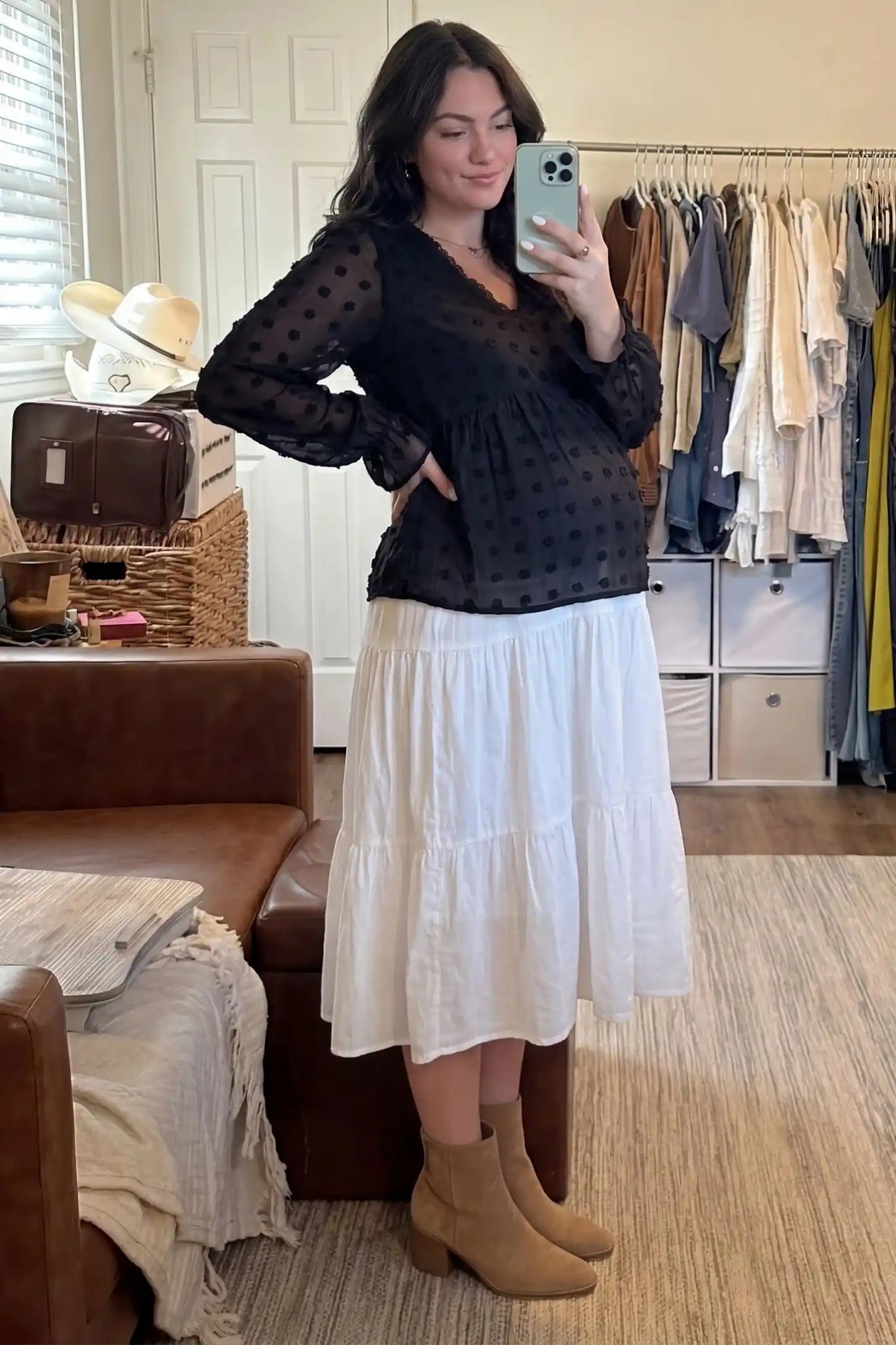 Swiss Dot Sheer Empire Waist Maternity Top Swiss Dot Sheer Empire Waist Maternity Top in black featuring a relaxed empire waist, UGC mirror selfie on a pregnant model.