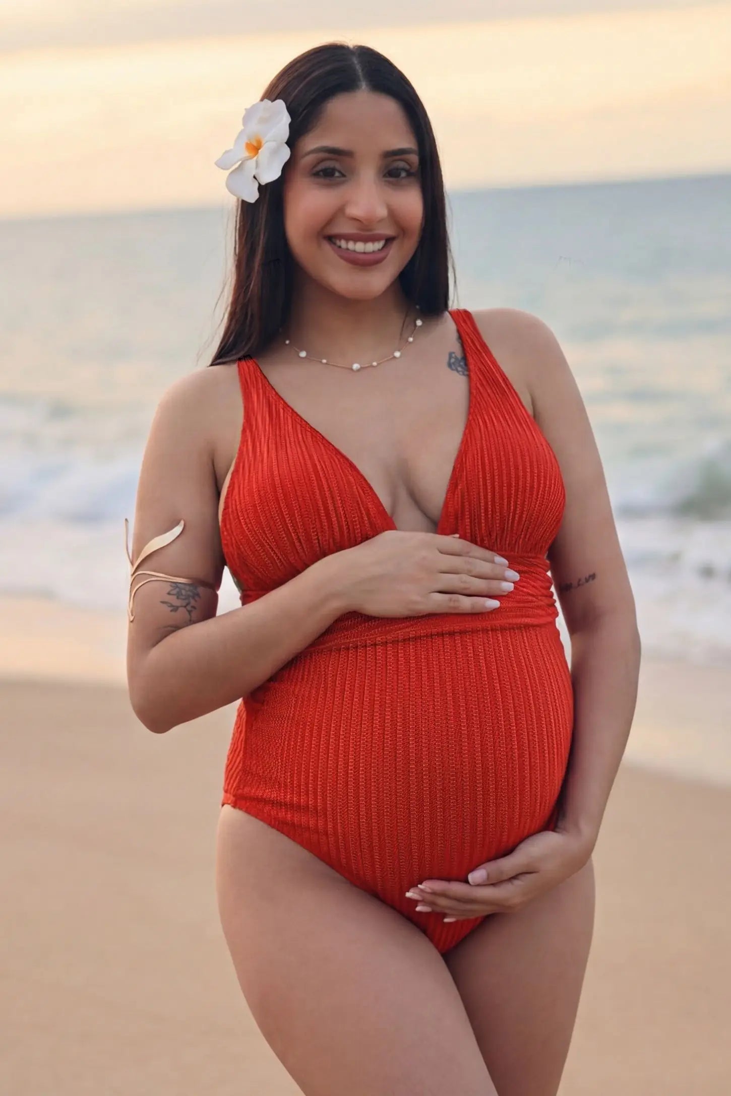 Textured Curve-Hugging Maternity One Piece Swimsuit Textured Curve-Hugging One Piece Swimsuit in Watermelon Red featuring a subtle ribbed pattern on a pregnant model, UGC view.