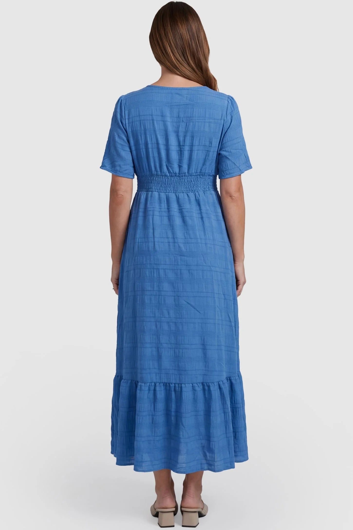 Textured Knit Butterfly Sleeve Maternity Midi Dress Textured Knit Butterfly Sleeve Midi Dress in Blue featuring feminine short butterfly sleeves on a pregnant model, back view.