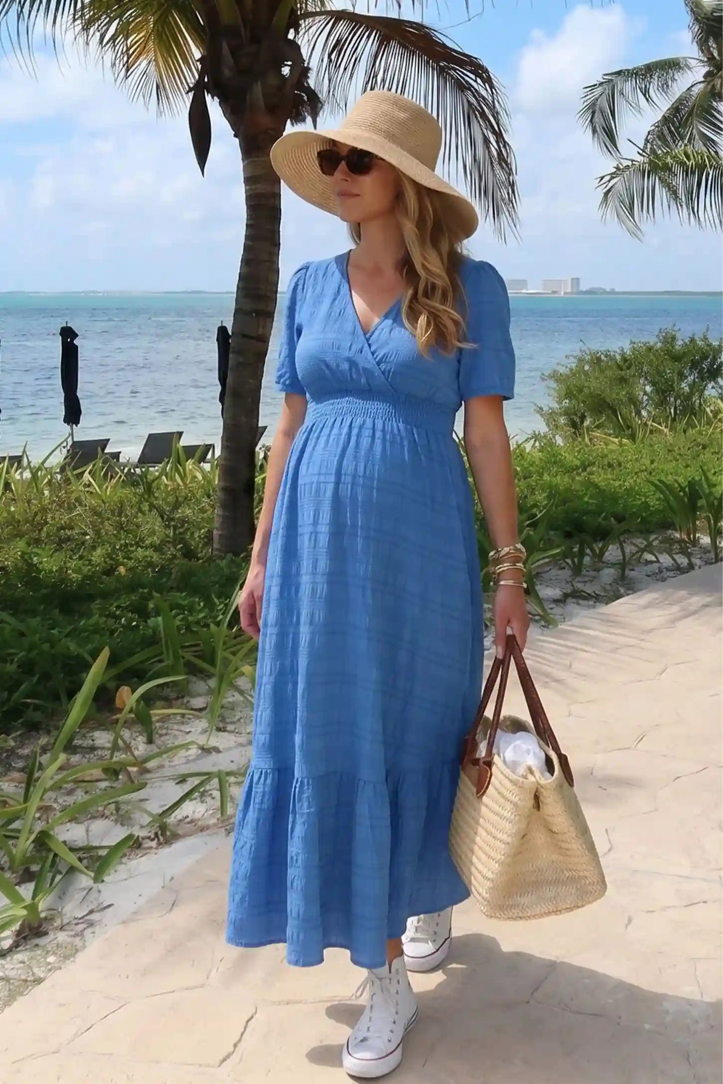 Textured Knit Butterfly Sleeve Maternity Midi Dress Textured Knit Butterfly Sleeve Midi Dress in Blue featuring feminine short butterfly sleeves on a pregnant model, editorial lifestyle view.