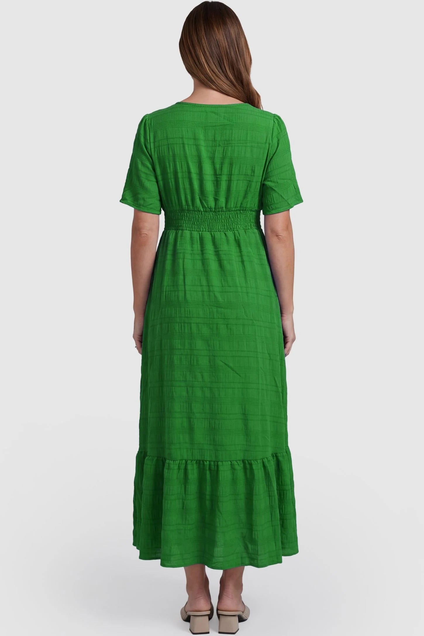 Textured Knit Butterfly Sleeve Maternity Midi Dress Textured Knit Butterfly Sleeve Midi Dress in Green featuring feminine short butterfly sleeves on a pregnant model, back view.