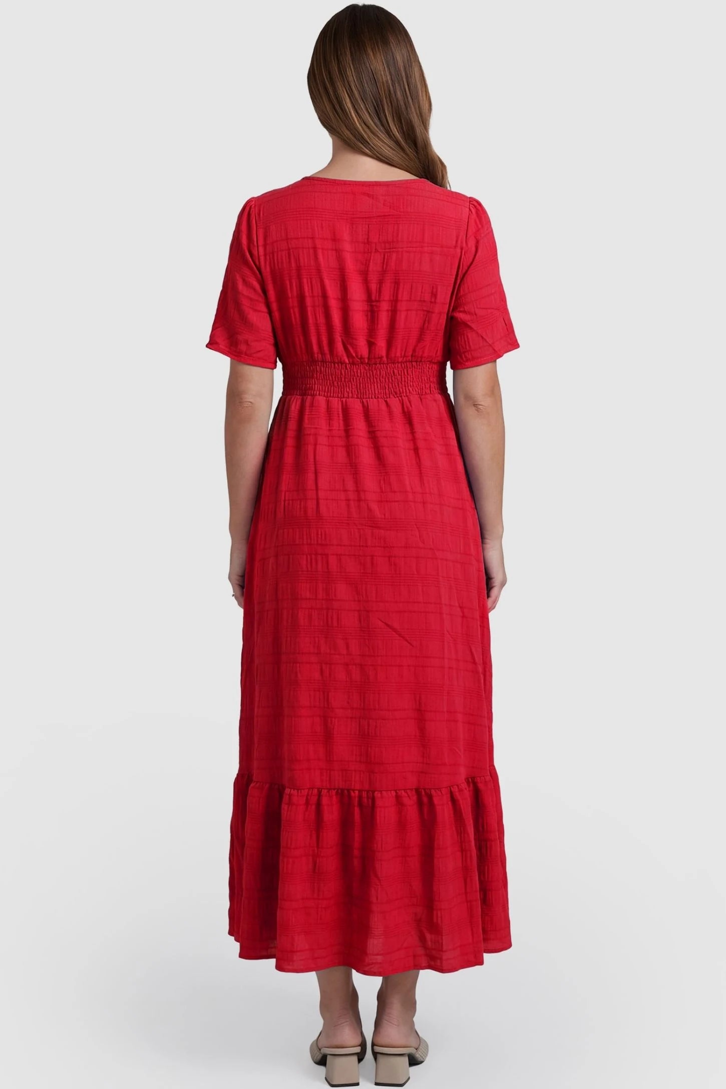 Textured Knit Butterfly Sleeve Maternity Midi Dress Textured Knit Butterfly Sleeve Midi Dress in Red featuring feminine short butterfly sleeves on a pregnant model, back view.