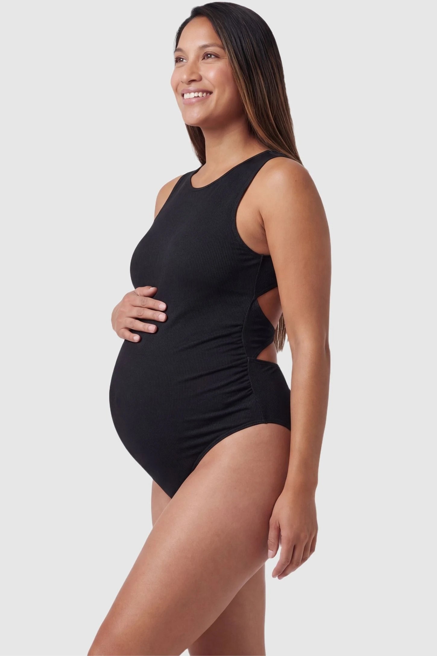 Ribbed Tie-Back Maternity Monokini Tie-Back High-Neck Maternity Monokini in Black with supportive high-neck cut on a pregnant model, side view.