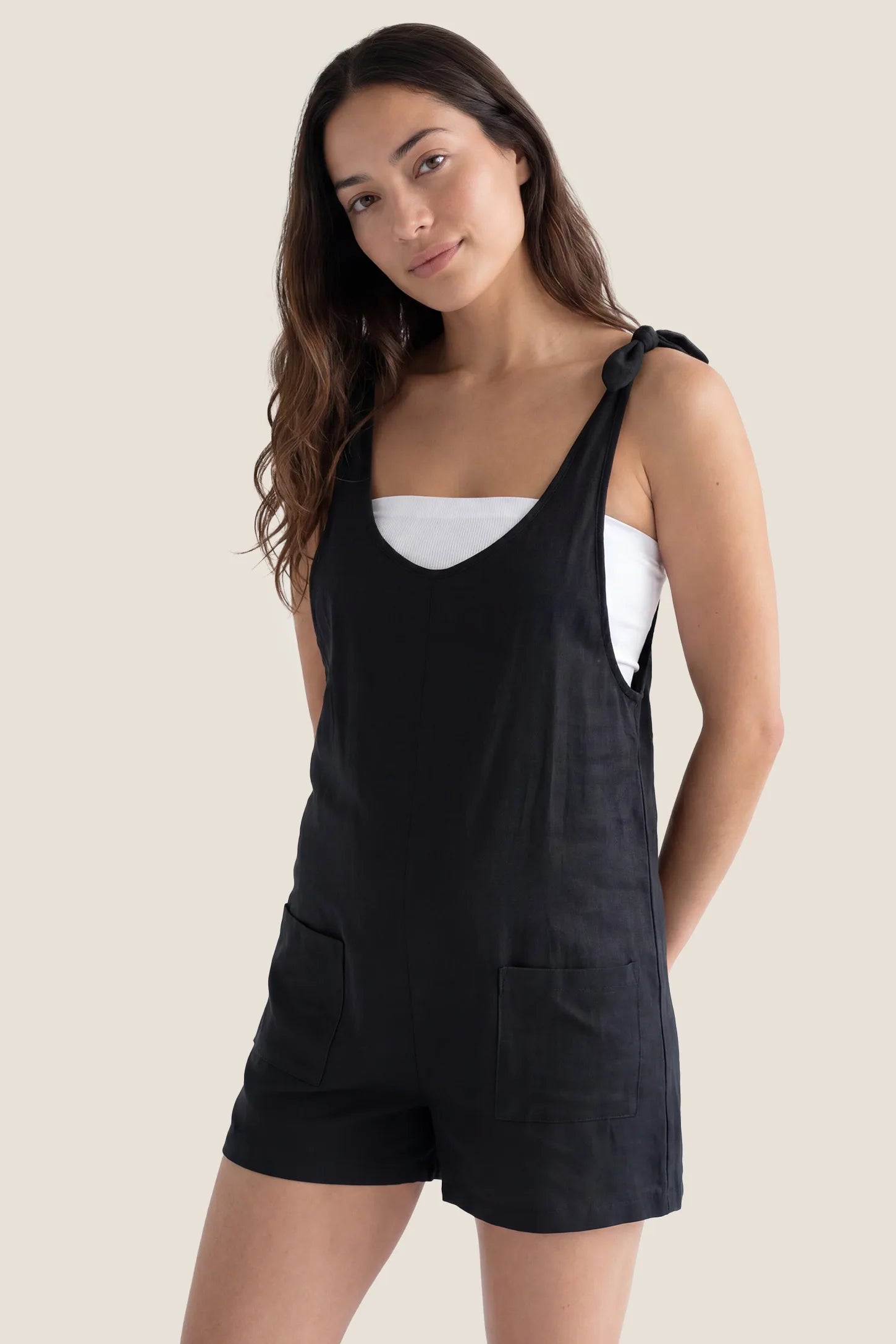 Tie-Strap Sleeveless Pocketed Maternity Romper Postpartum hero view of the black Tie-Strap Sleeveless Pocketed Maternity Romper with a flattering relaxed silhouette.
