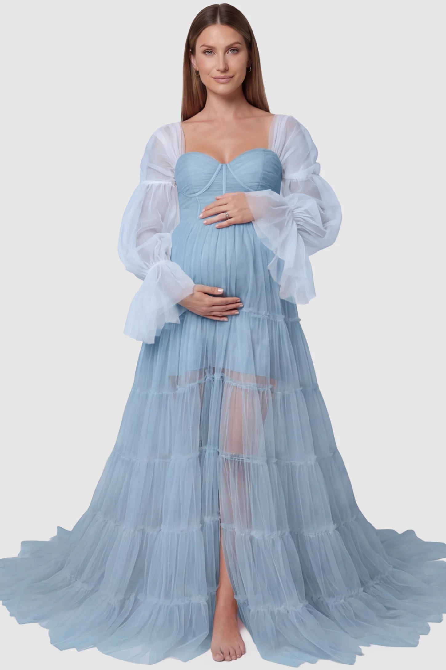 Tiered Tulle Long Sleeve Maternity Photoshoot Gown Tiered Tulle Long Sleeve Maternity photoshoot Gown in Blue featuring a sweetheart neckline and voluminous tulle layers on a pregnant model, front view.